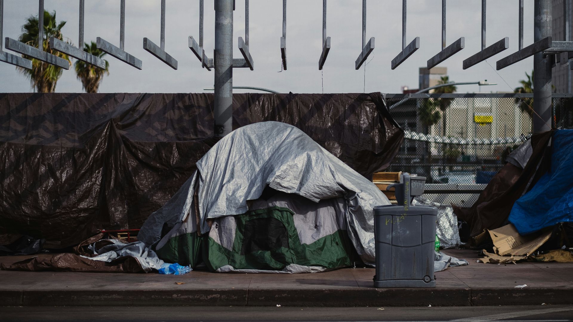 a pile of garbage sitting on the side of a road