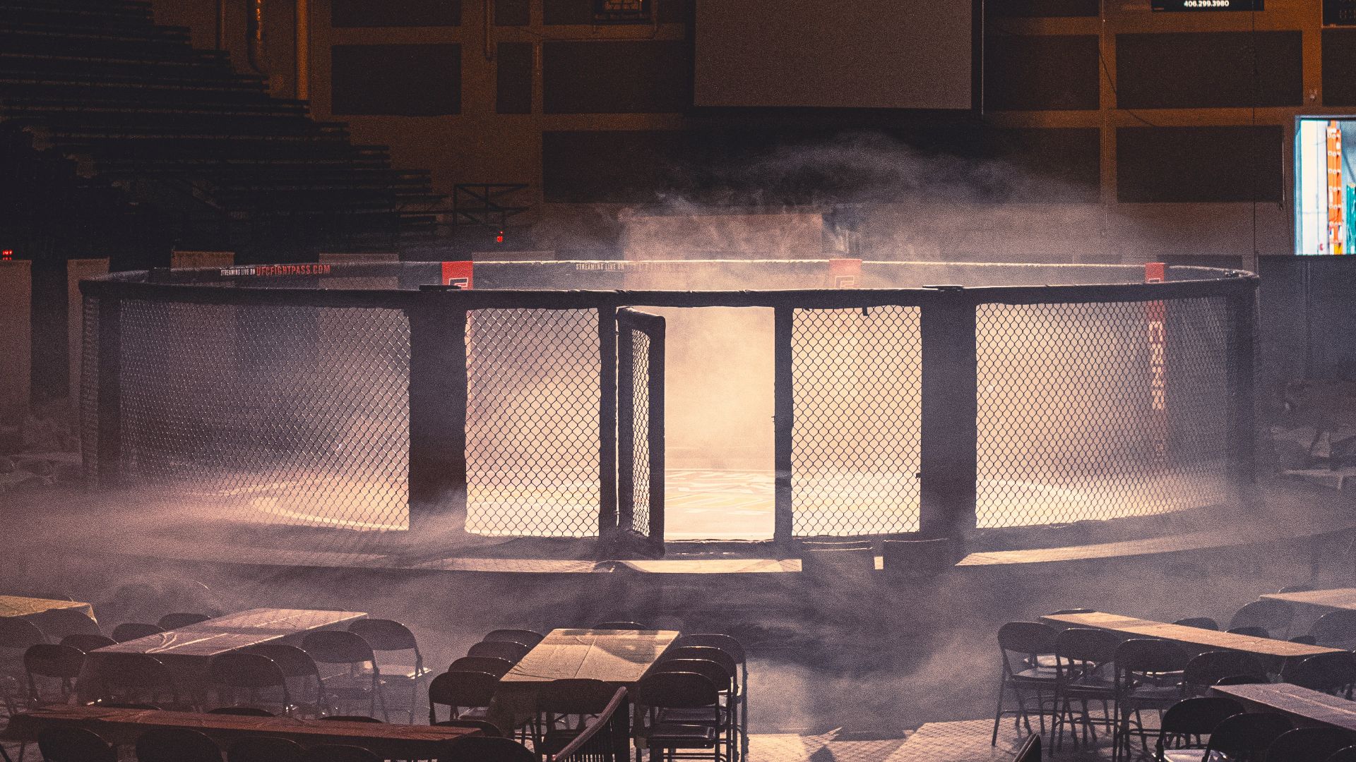 a room filled with tables covered in smoke