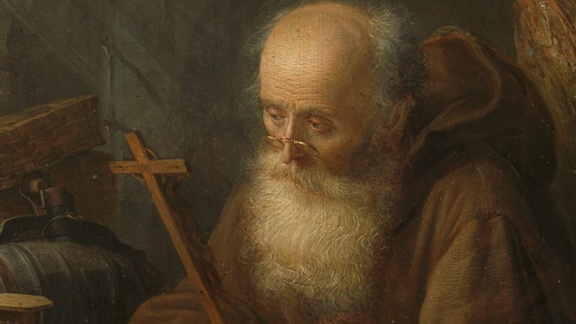 man in brown robe painting