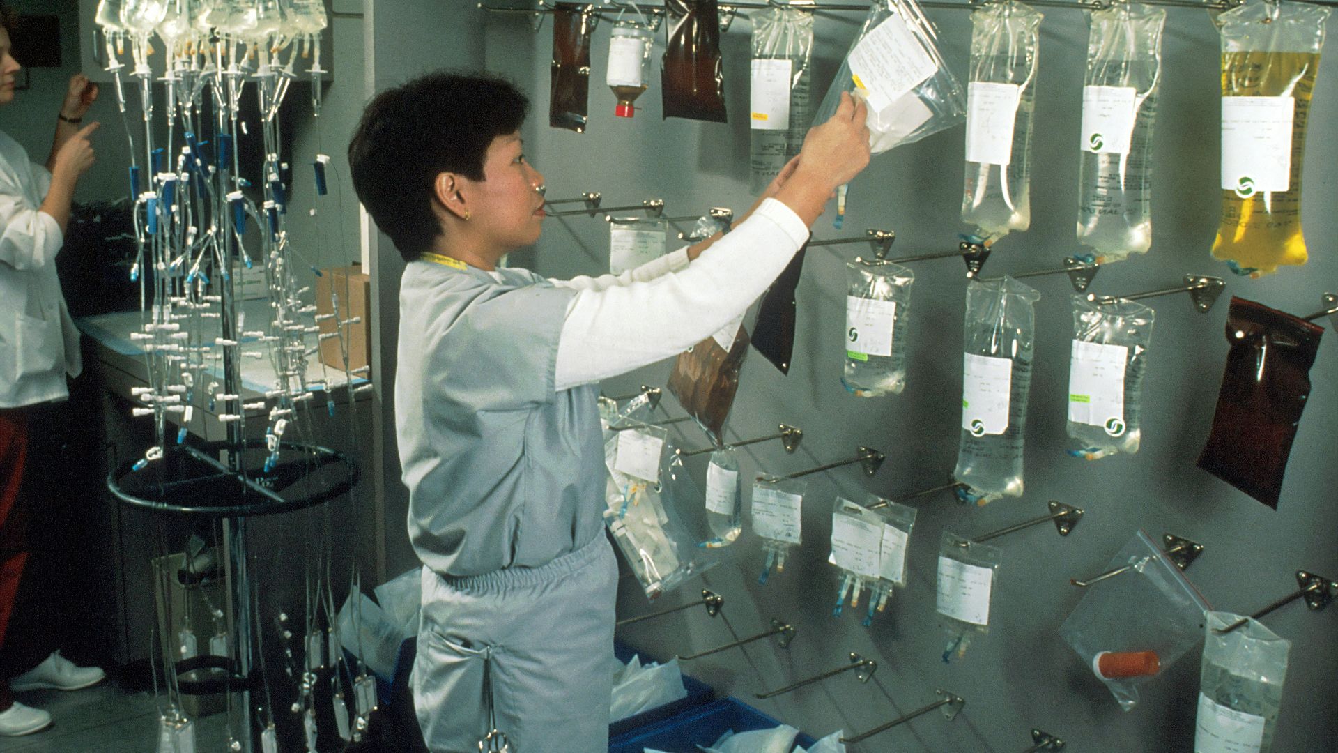 woman arranging IV bags