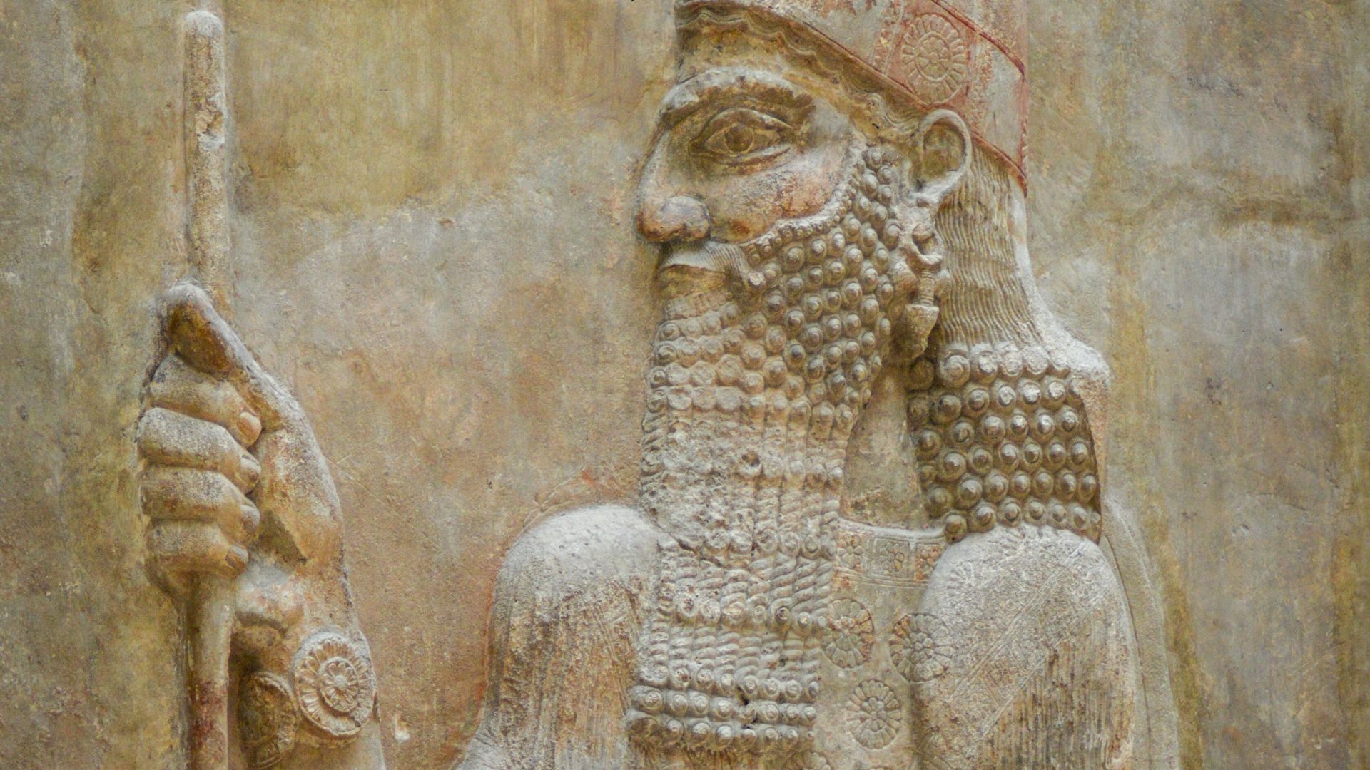 A statue of a man holding a staff