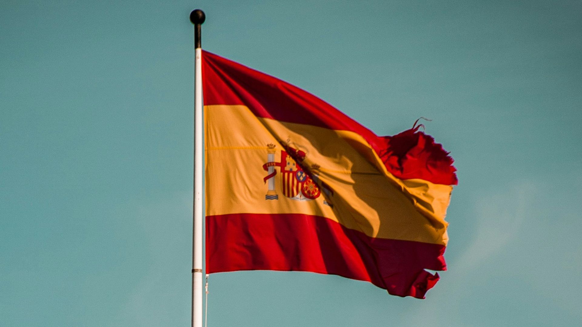 a flag flying on top of a castle