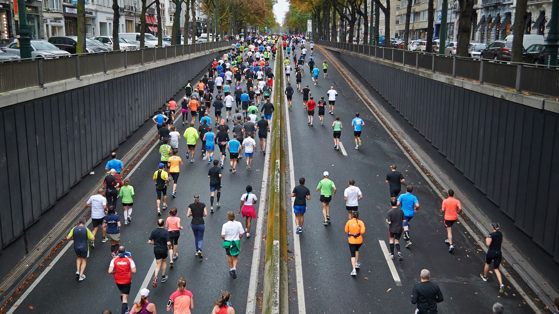 people running on road during daytime