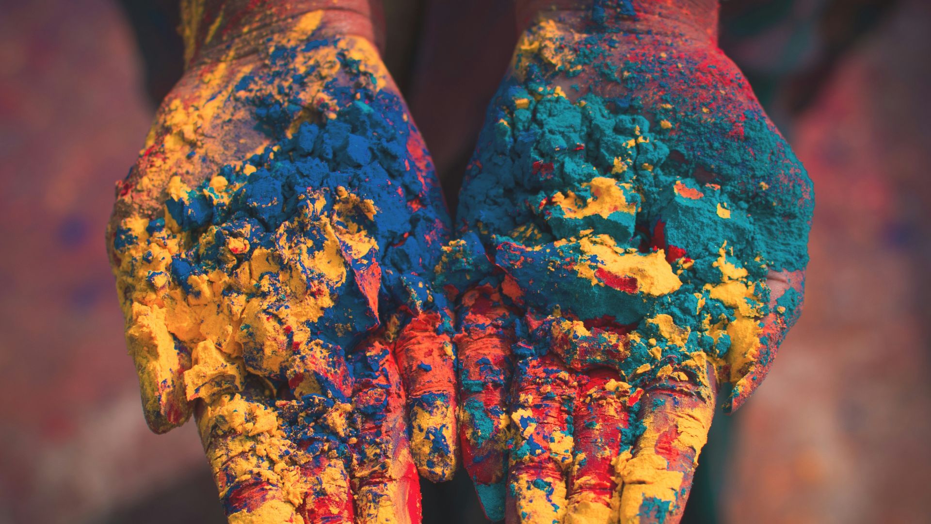 closeup photo of person holding color soils