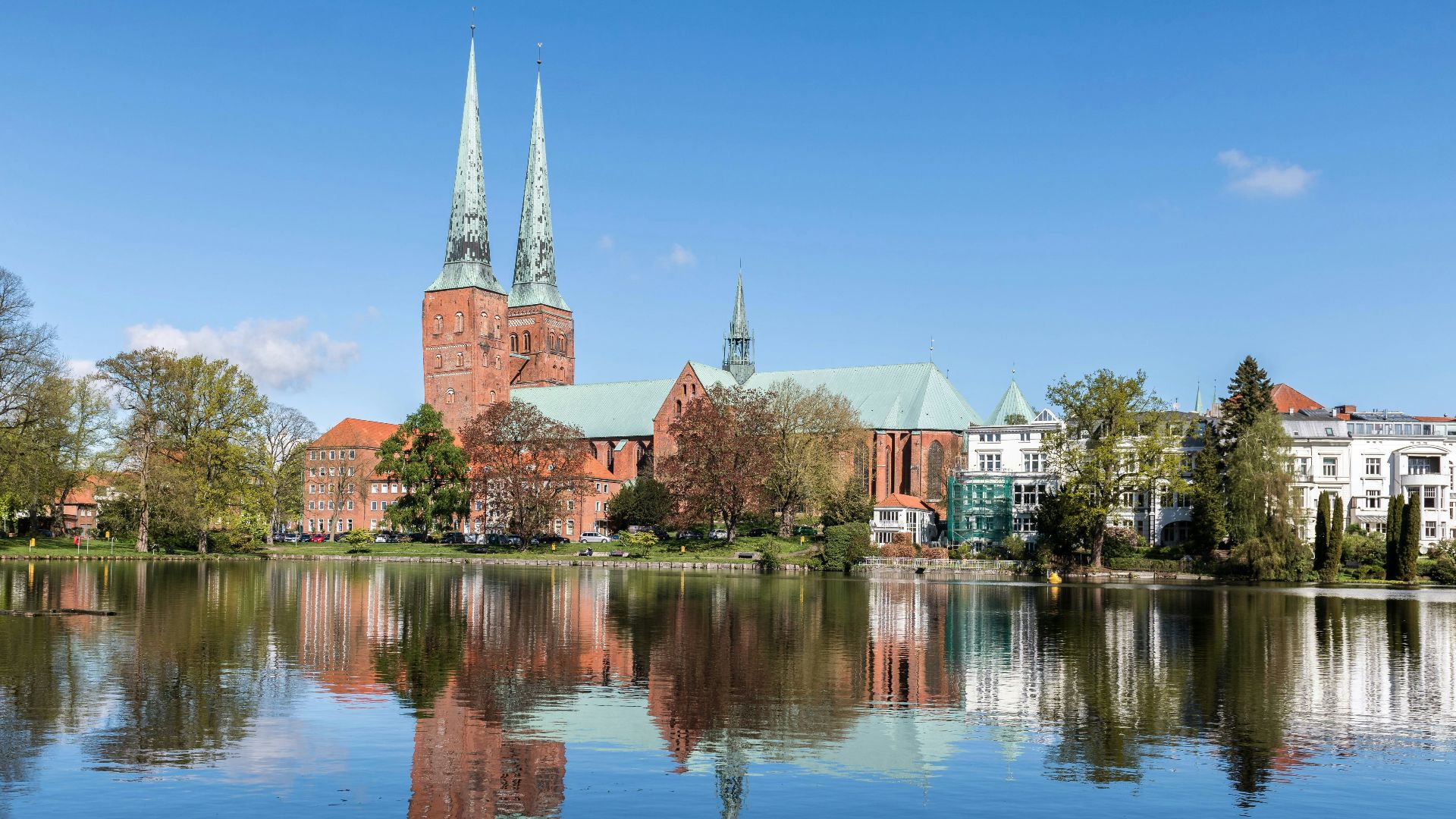 a lake with a church in the background