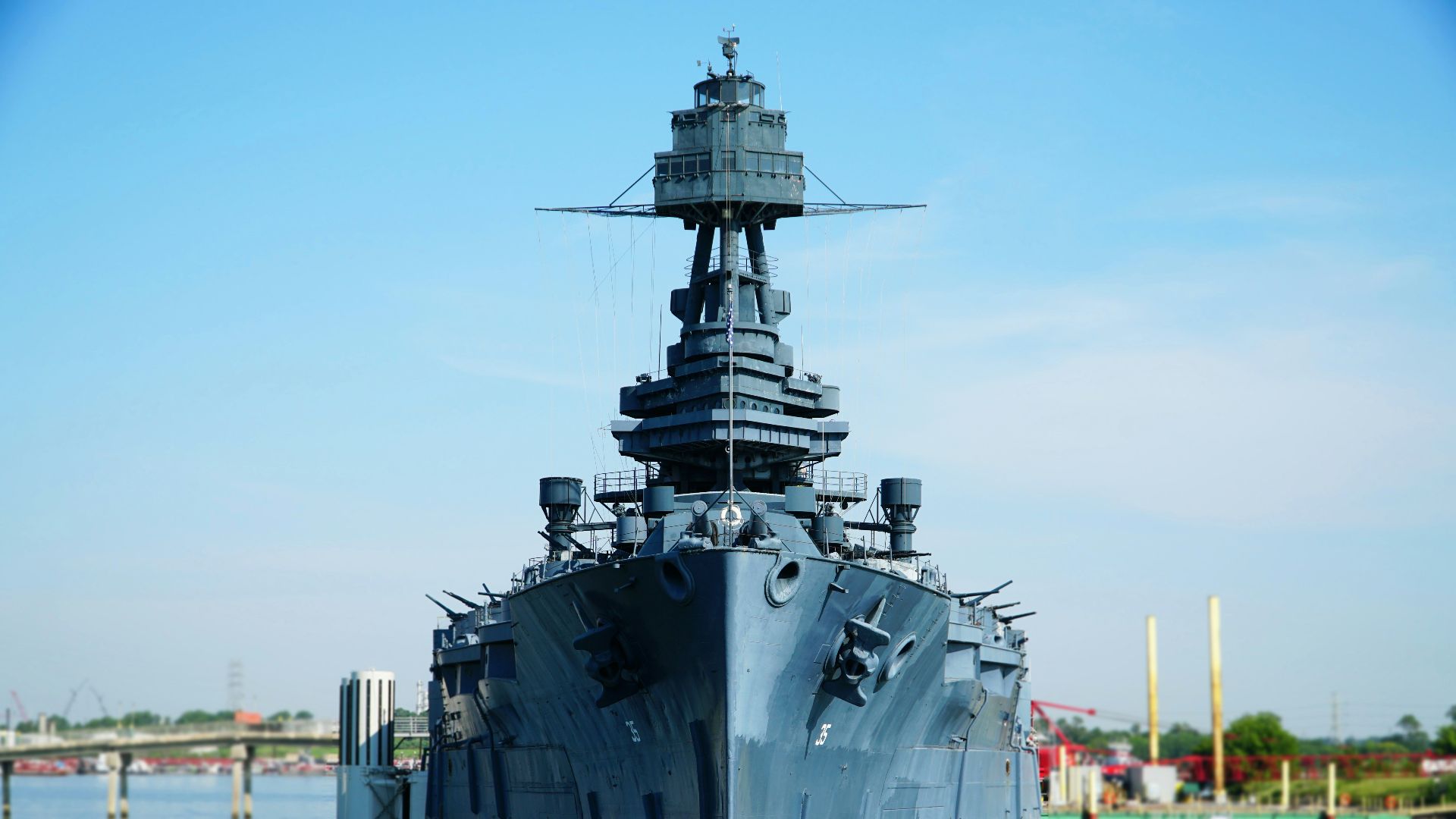 gray battleship on body of water during daytime
