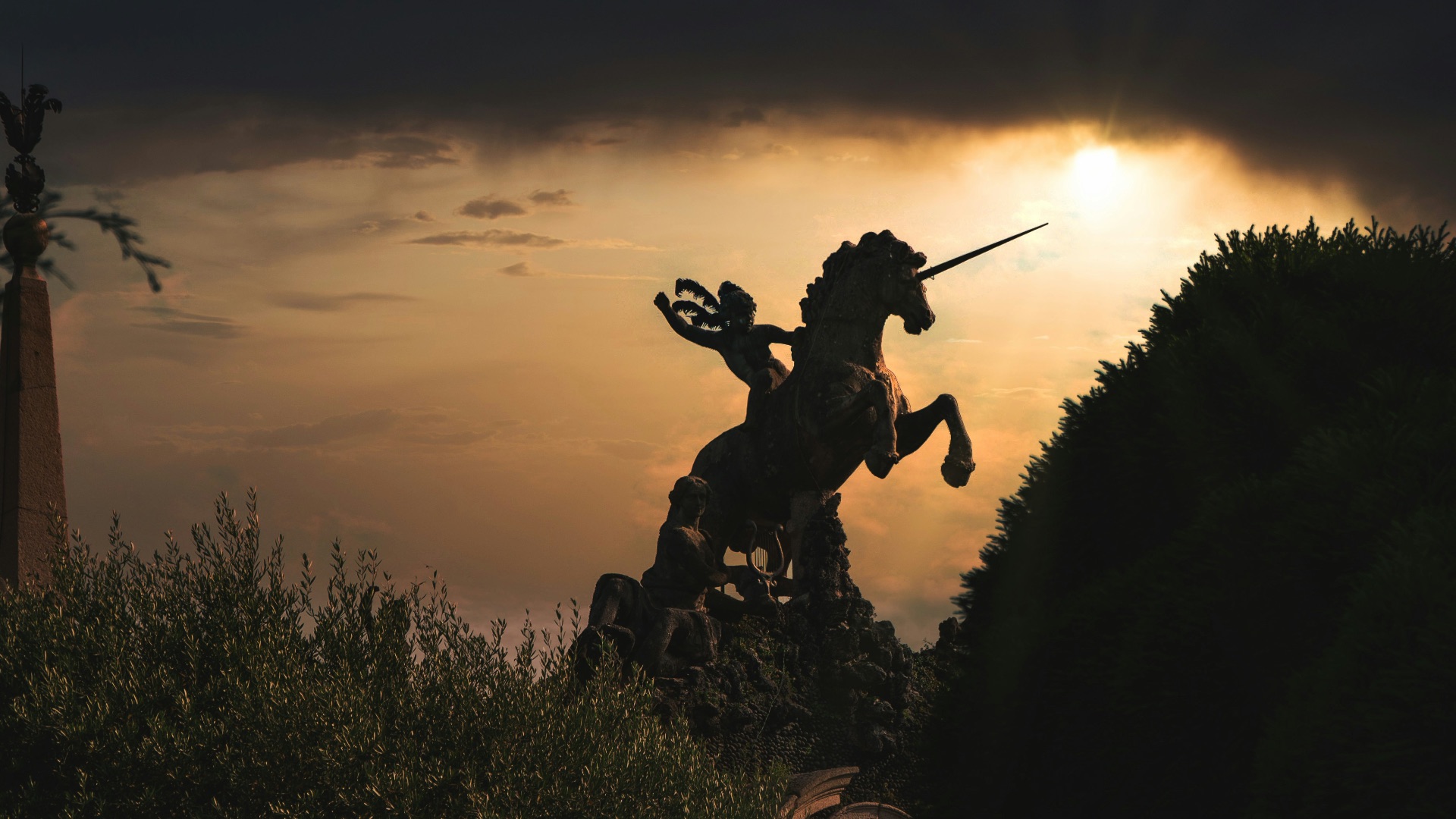 silhouette of man holding stick during sunset