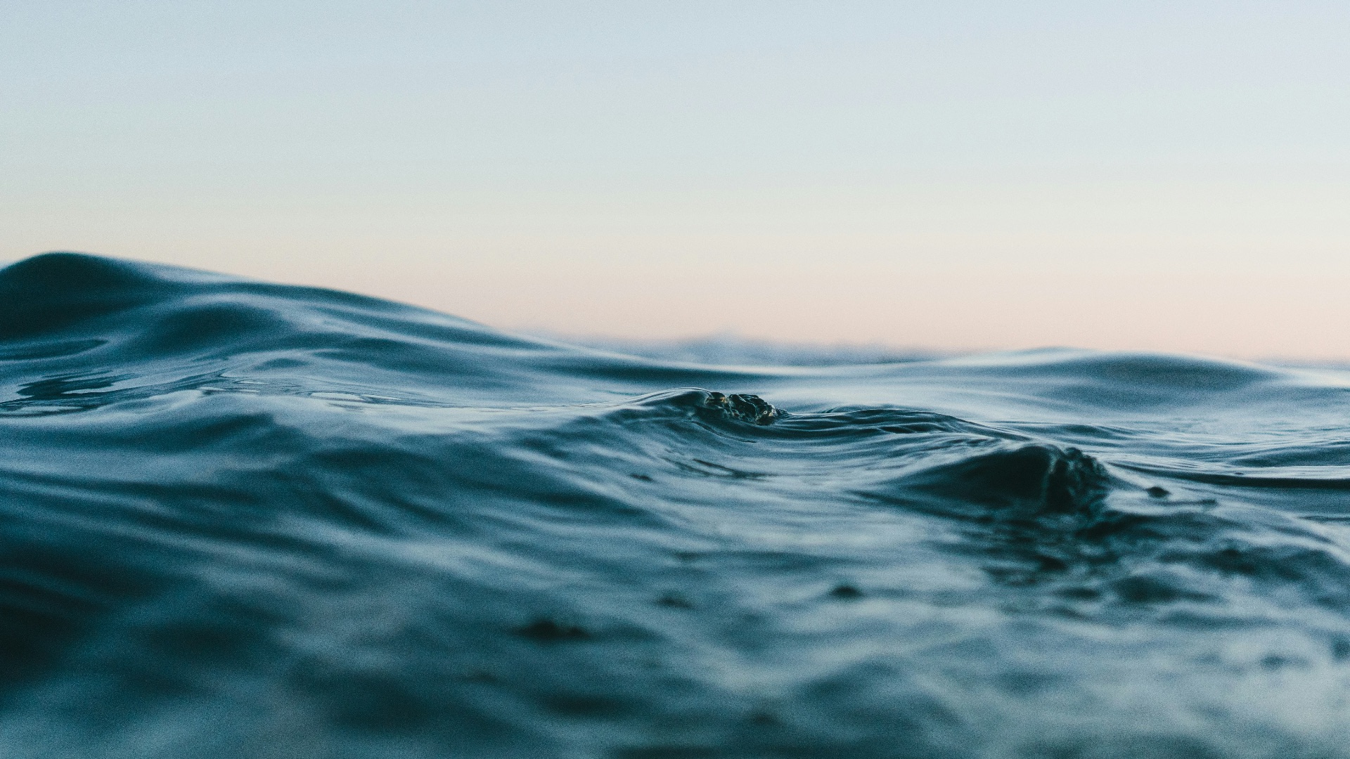 body of water under sky