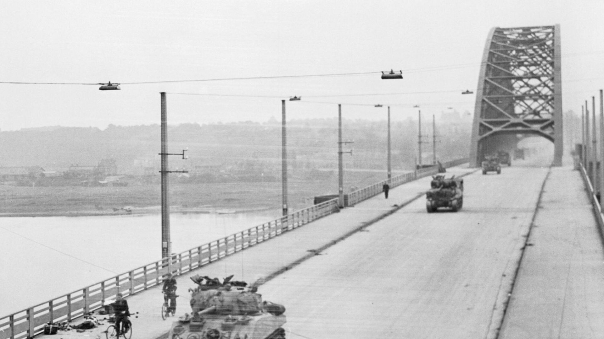 File:British XXX Corps cross the road bridge at Nijmegen.jpg