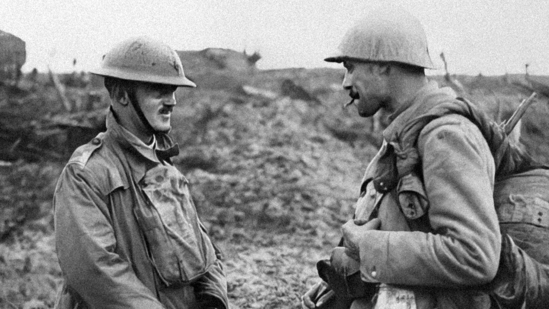 a couple of men standing next to each other