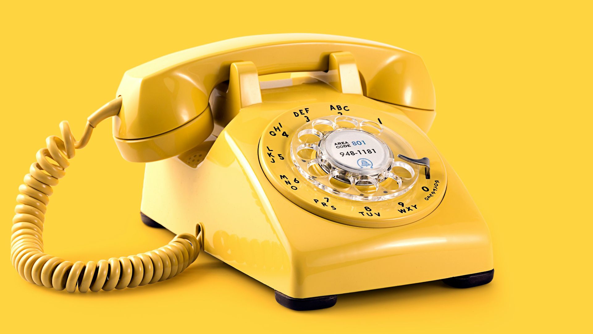 yellow rotary telephone