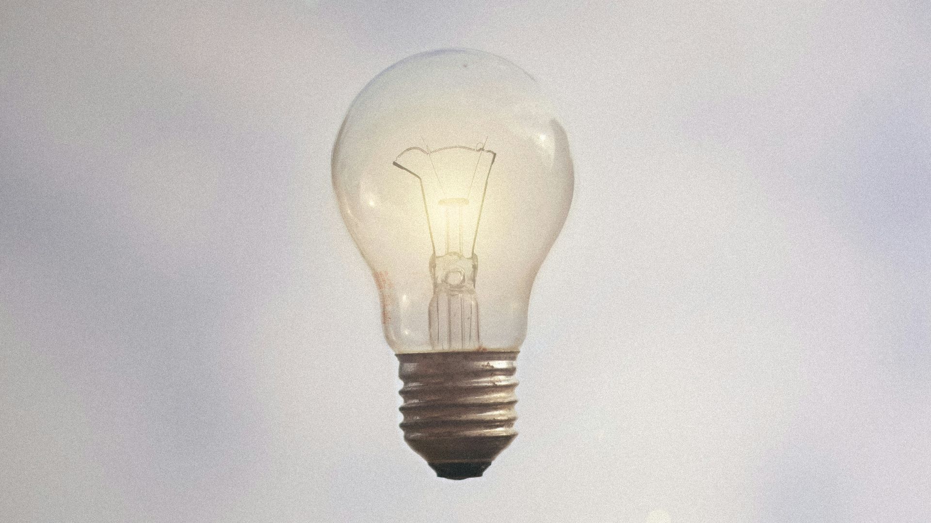 person catching light bulb