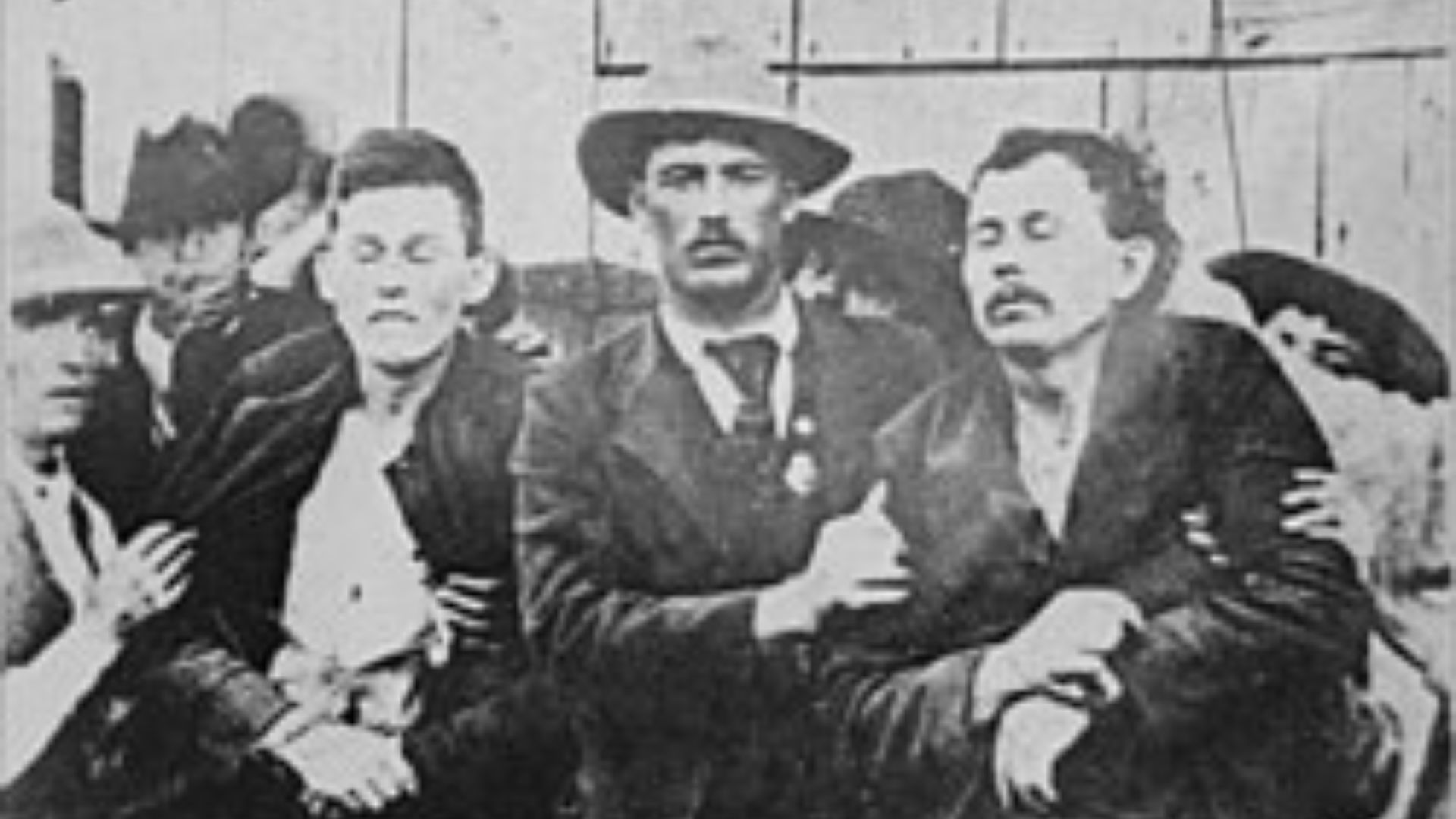 File:Law enforcement officers hold up the bodies of Bob and Grat ...