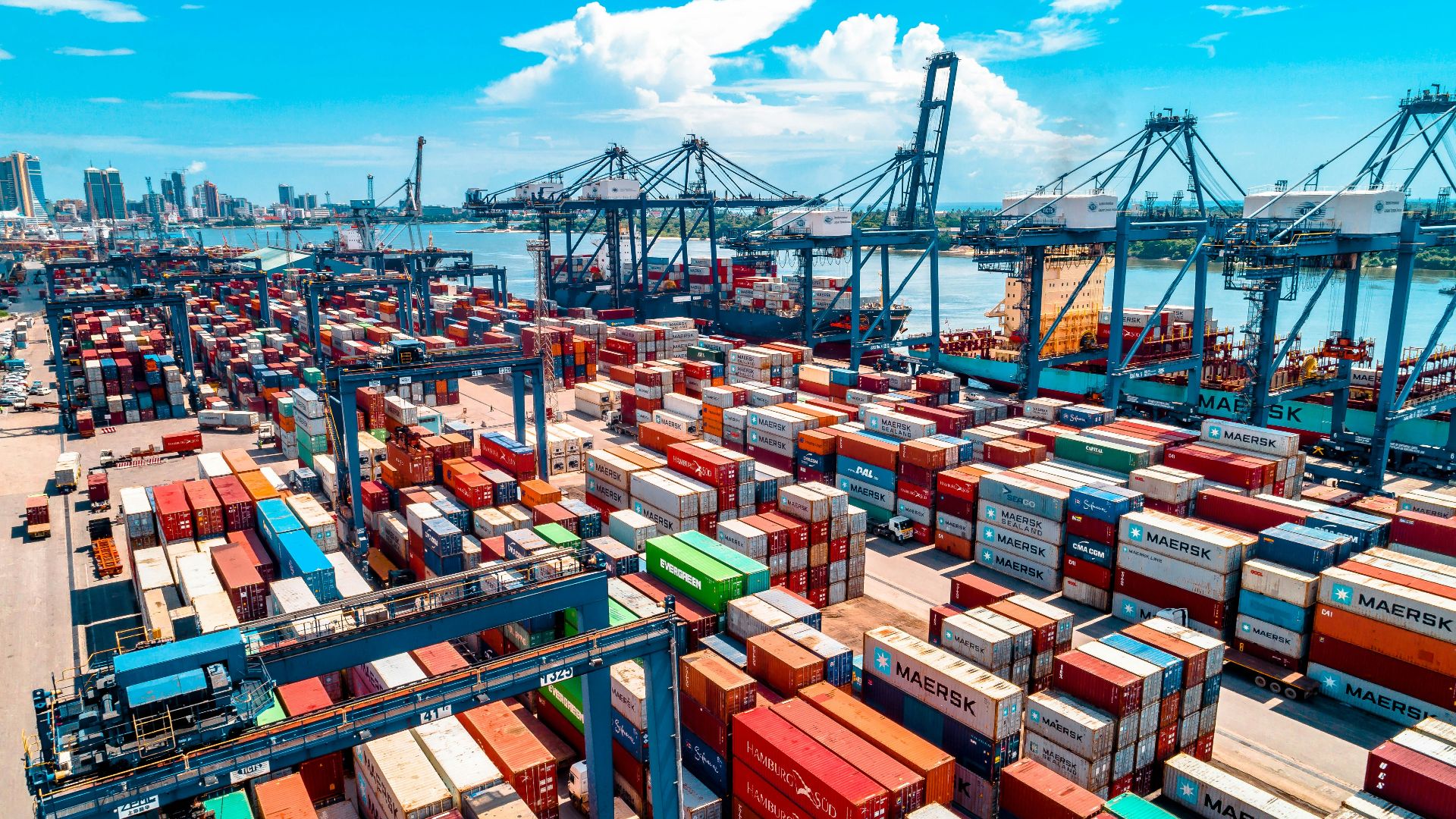 a large amount of containers are stacked on top of each other