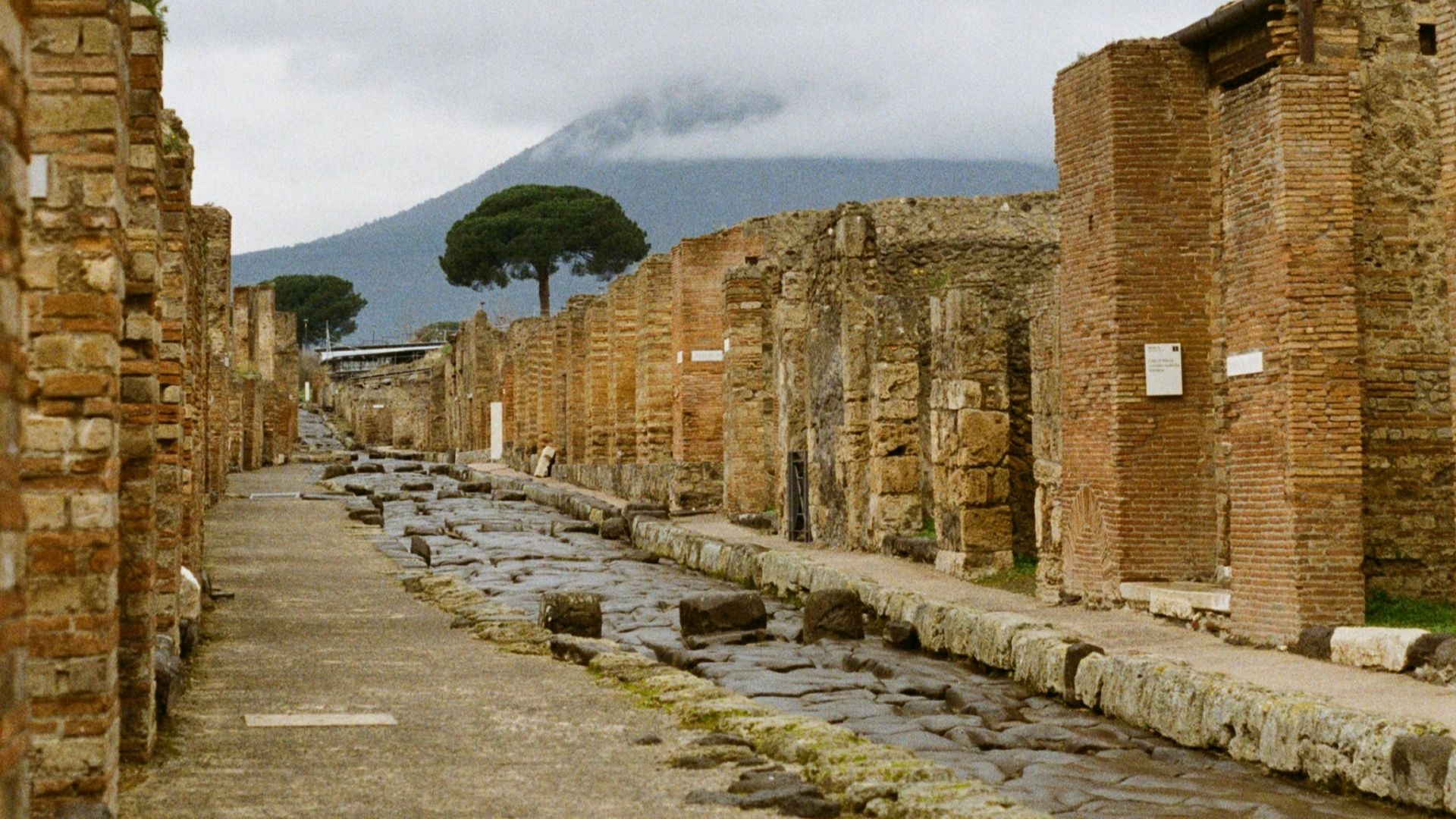 A cobblestone street lined with ancient buildings