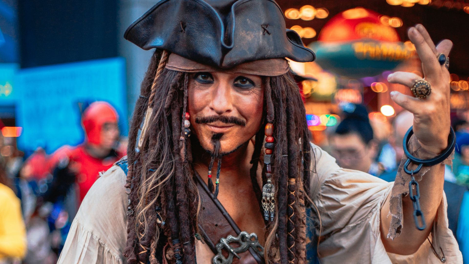 A man with dreadlocks and a pirate costume