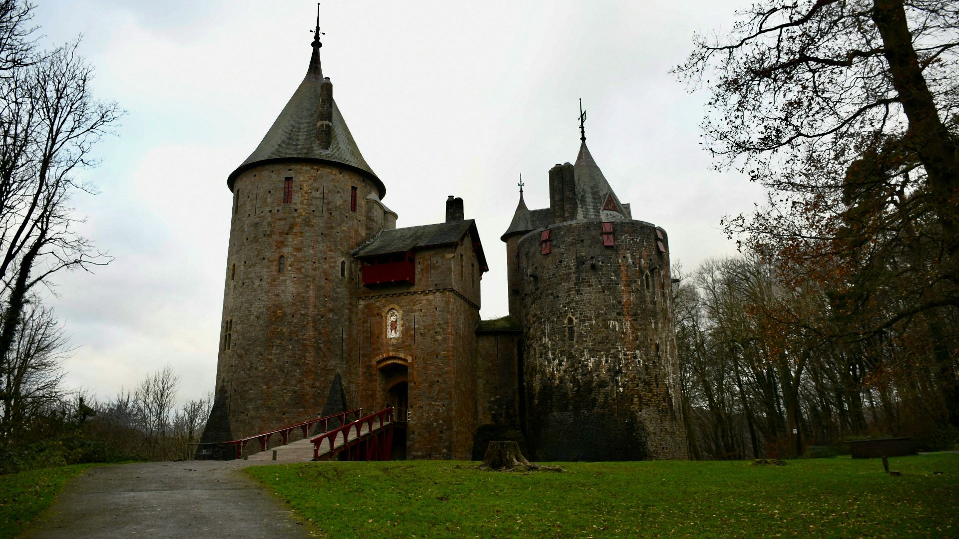an old castle with a walkway leading to it