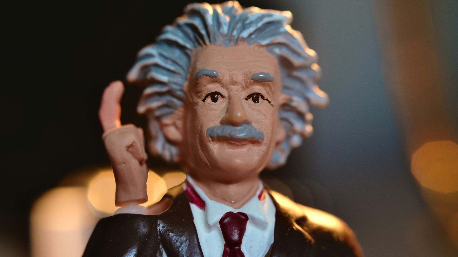 man in black suit jacket figurine