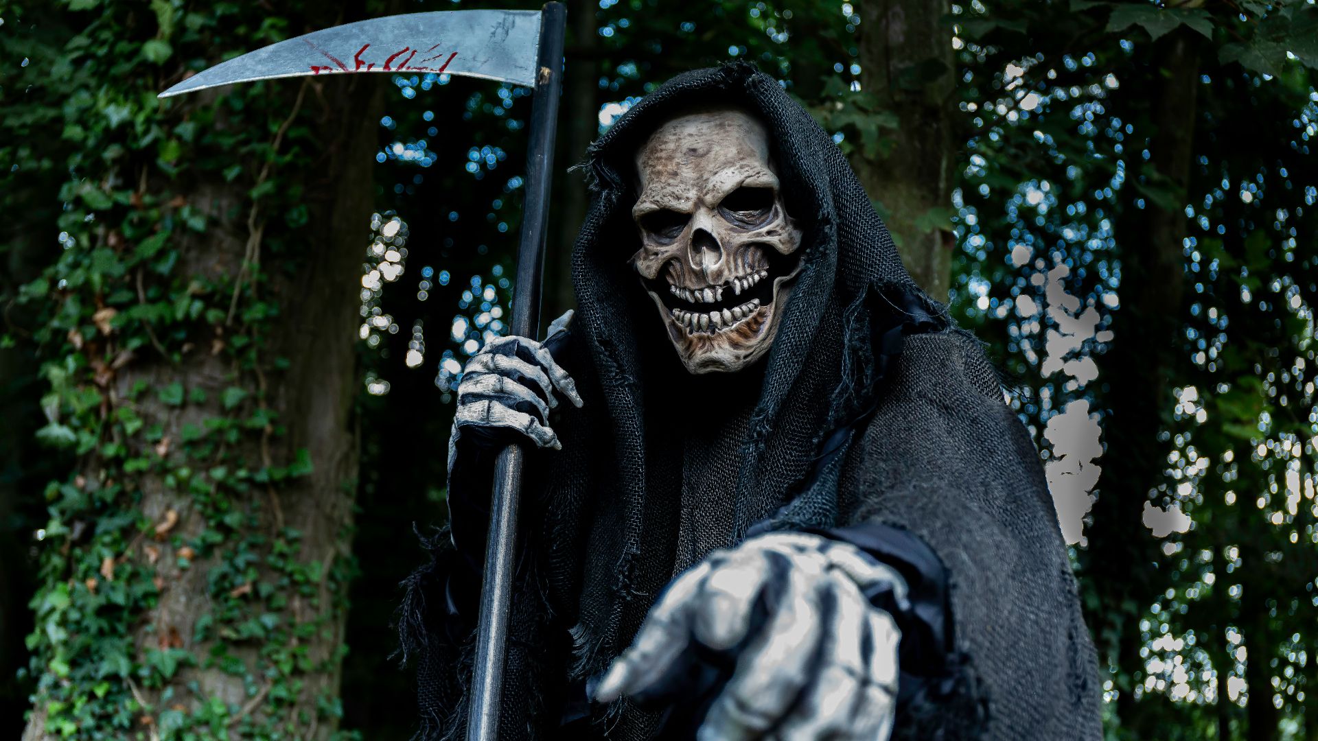 a man dressed in a skeleton costume holding an axe
