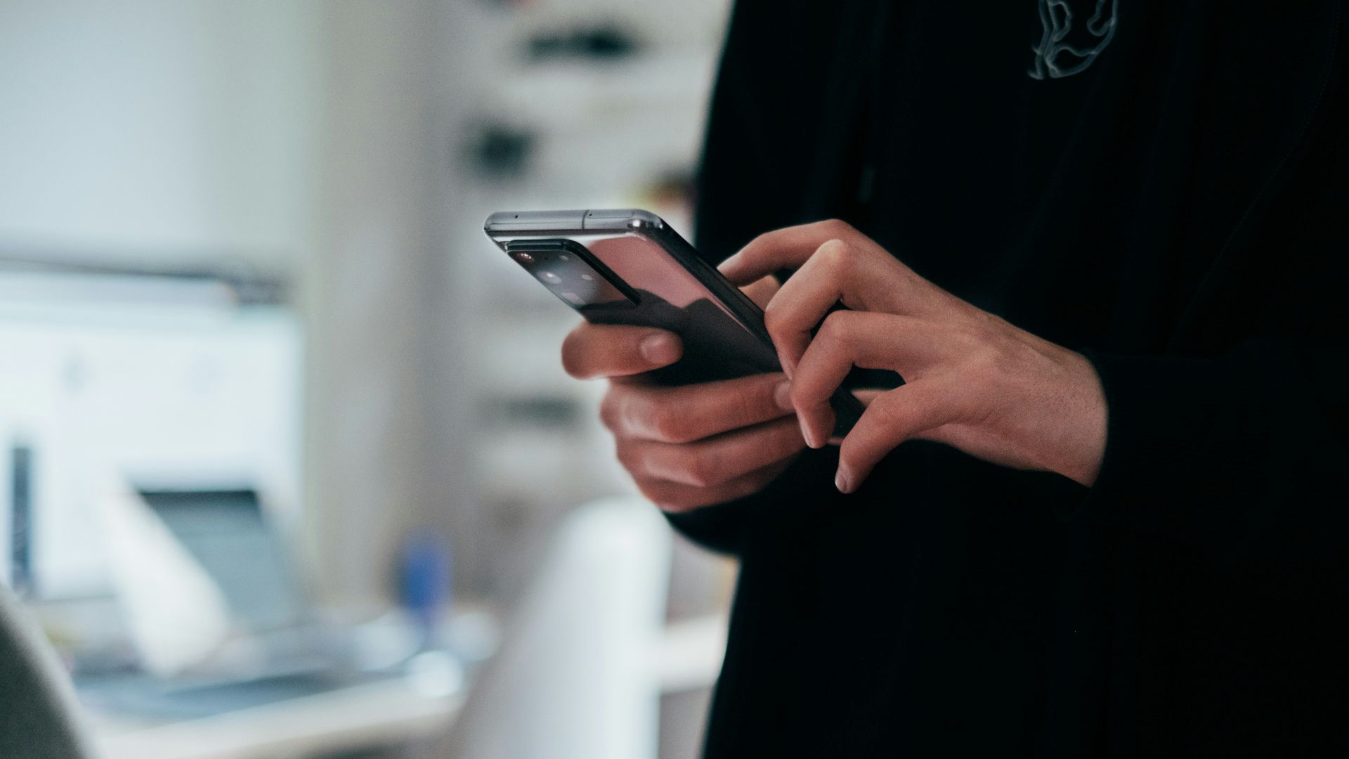 person holding black android smartphone