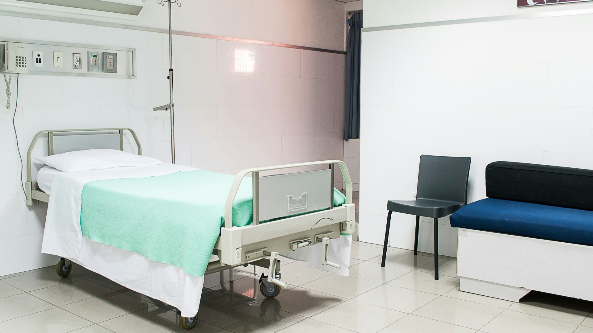 hospital bed near couch