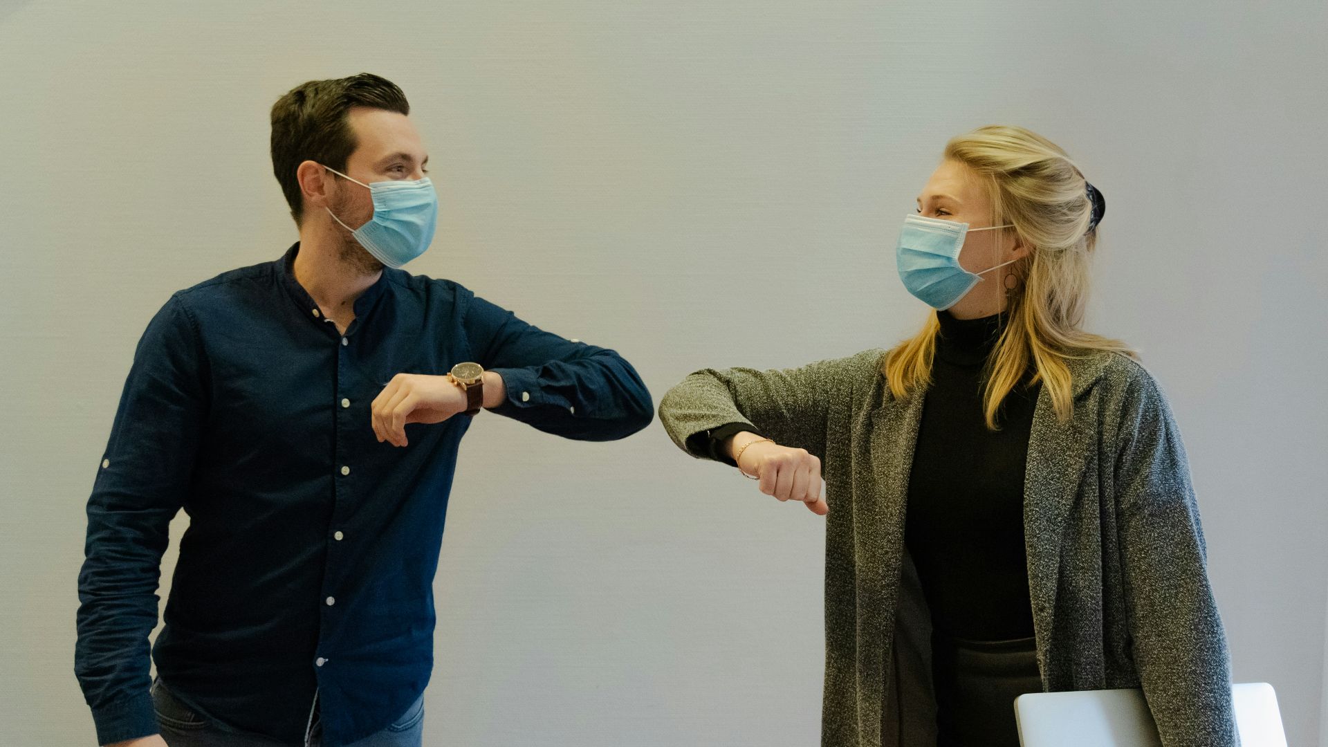 woman in black jacket holding white paper