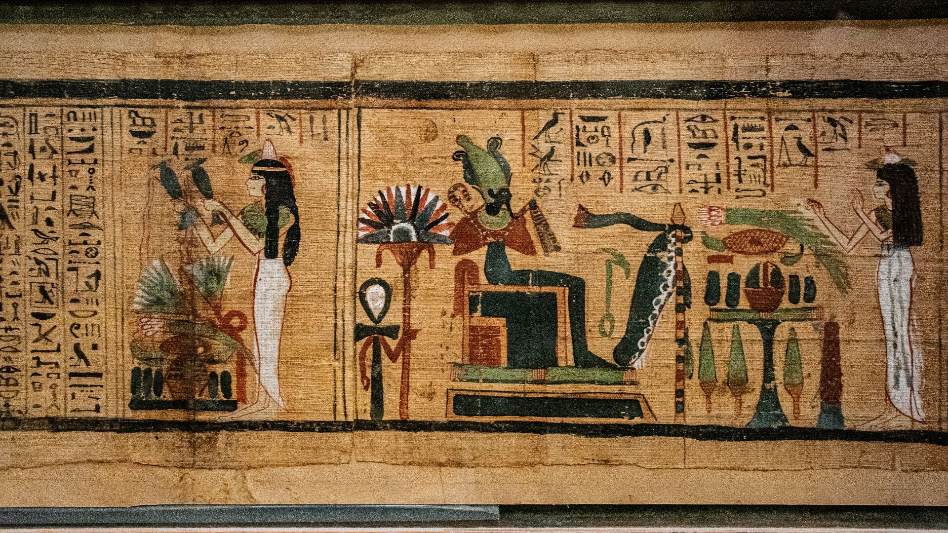 man in black suit standing on brown wooden door