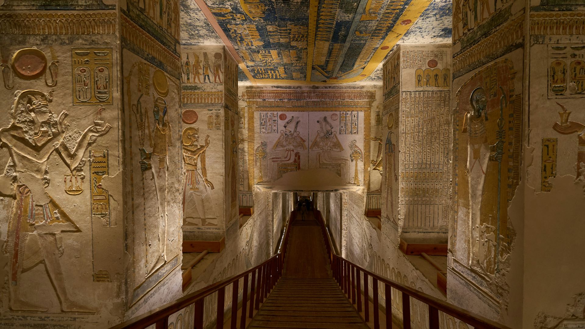 a long hallway with paintings on the walls