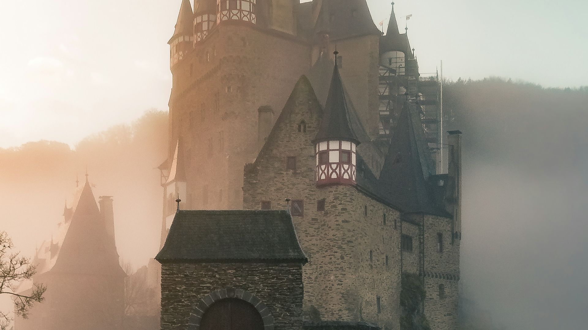 reflection of a castle surrounded with fogs