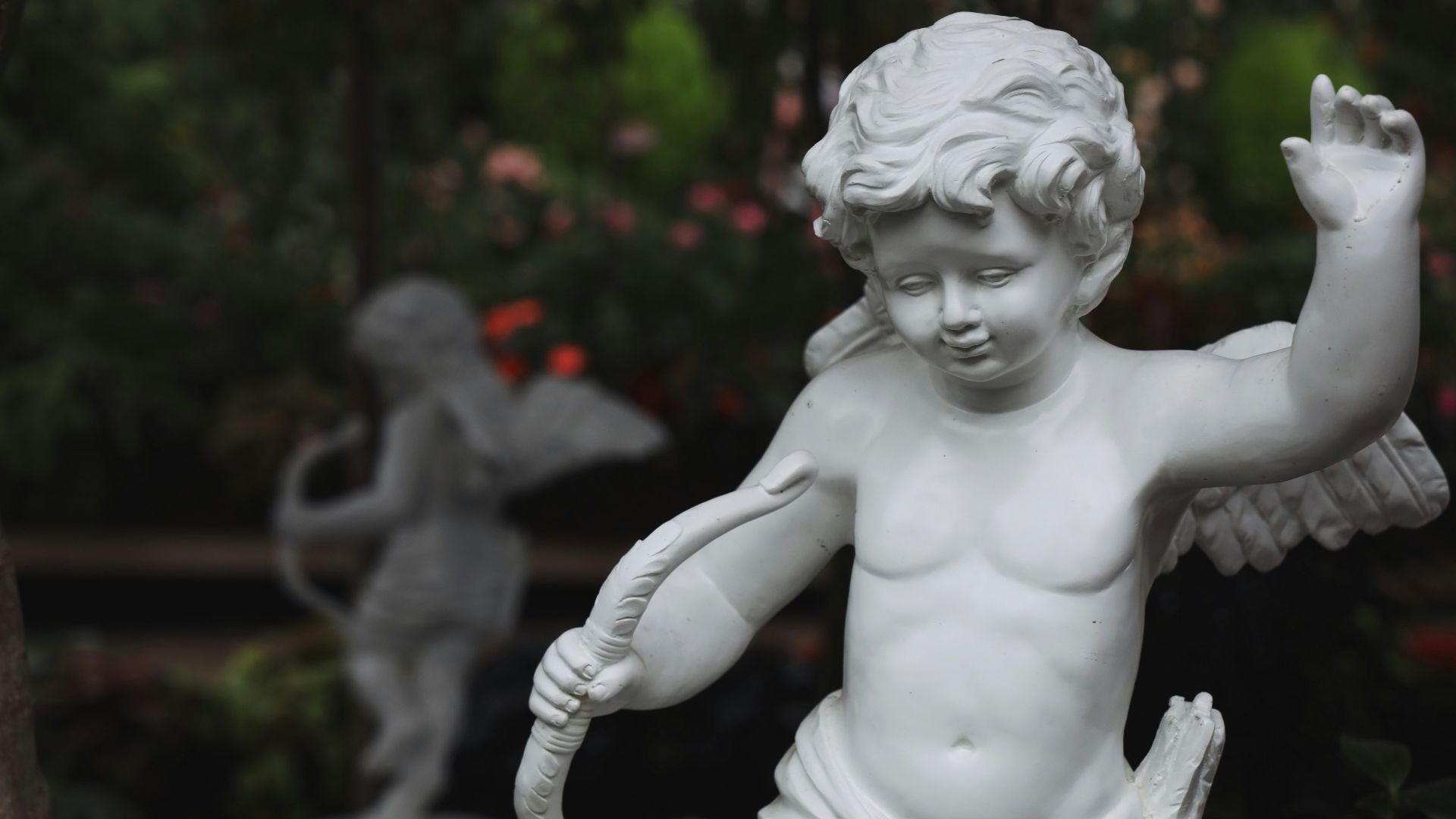 white ceramic statue of a topless woman