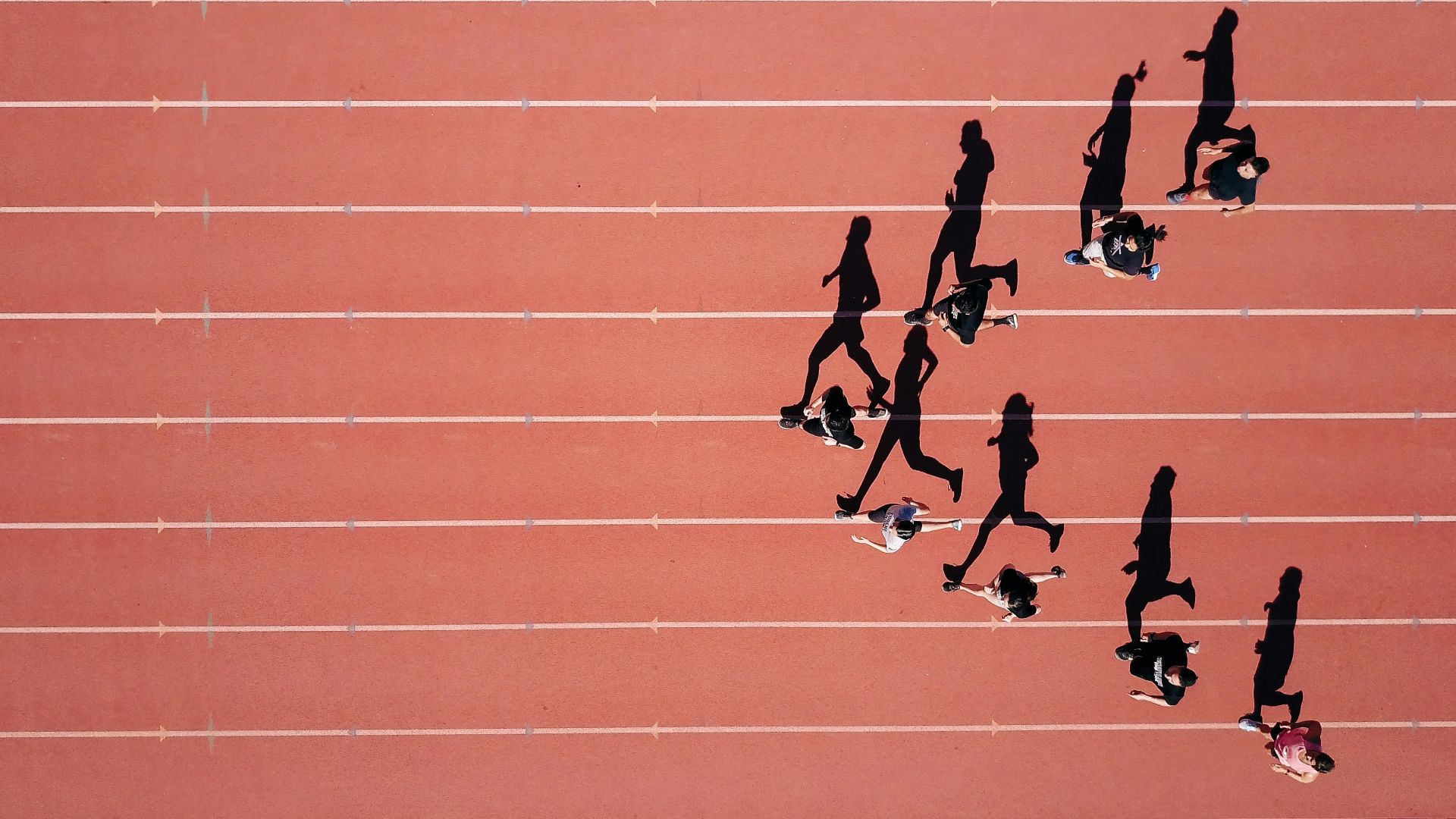 group of people running on stadium