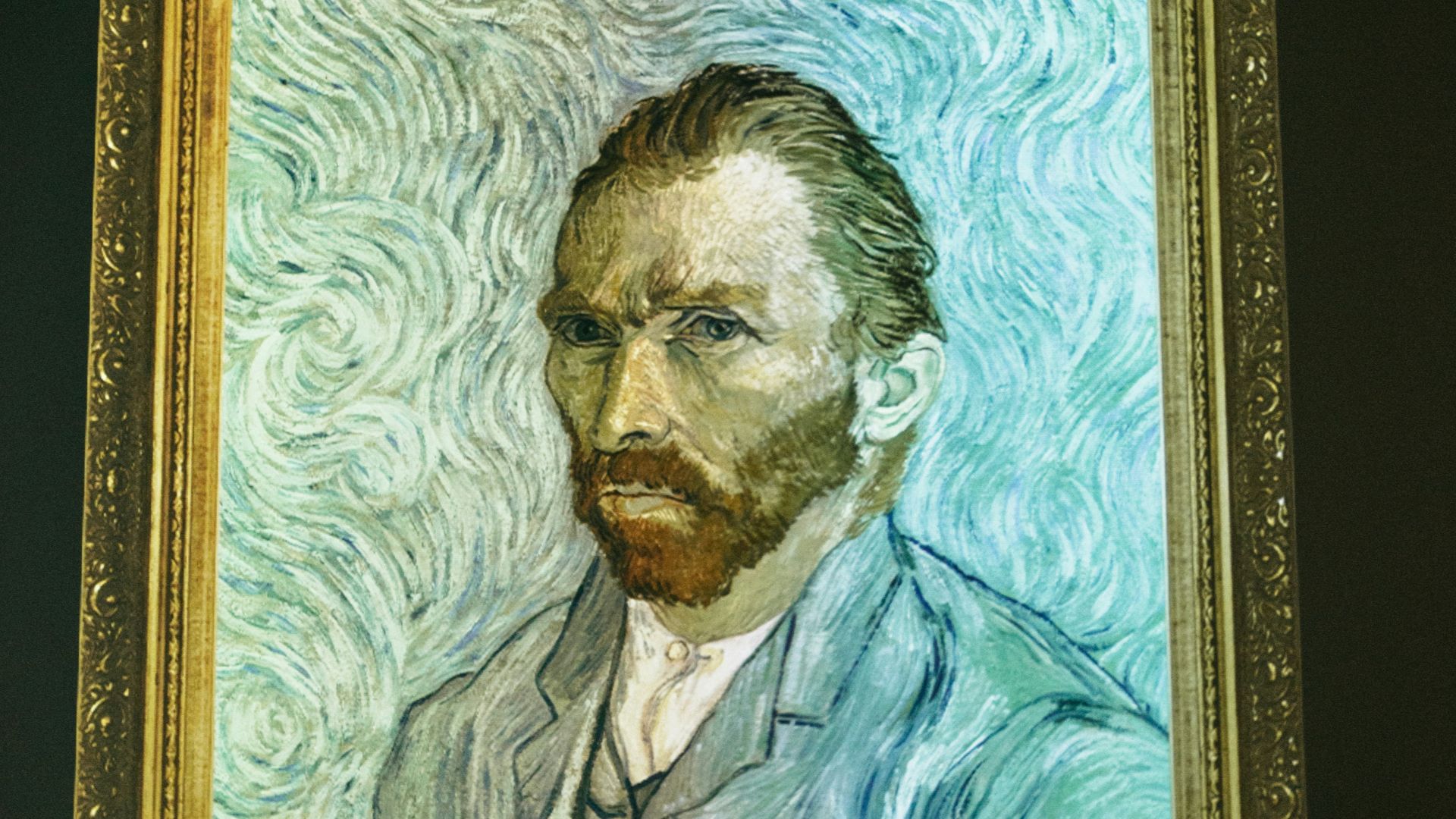 man and woman in black suit painting