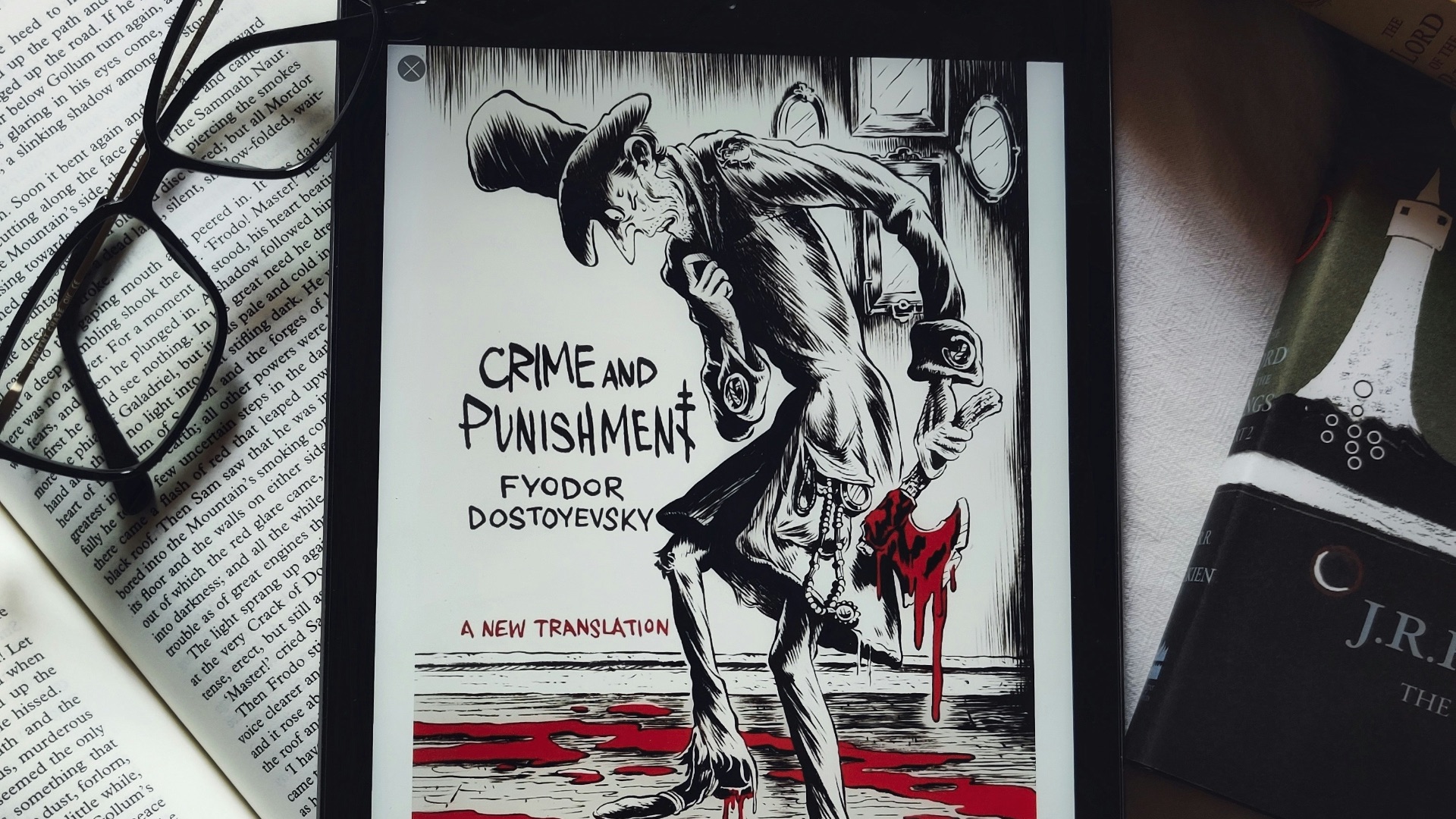 a picture of a book and some glasses on a table