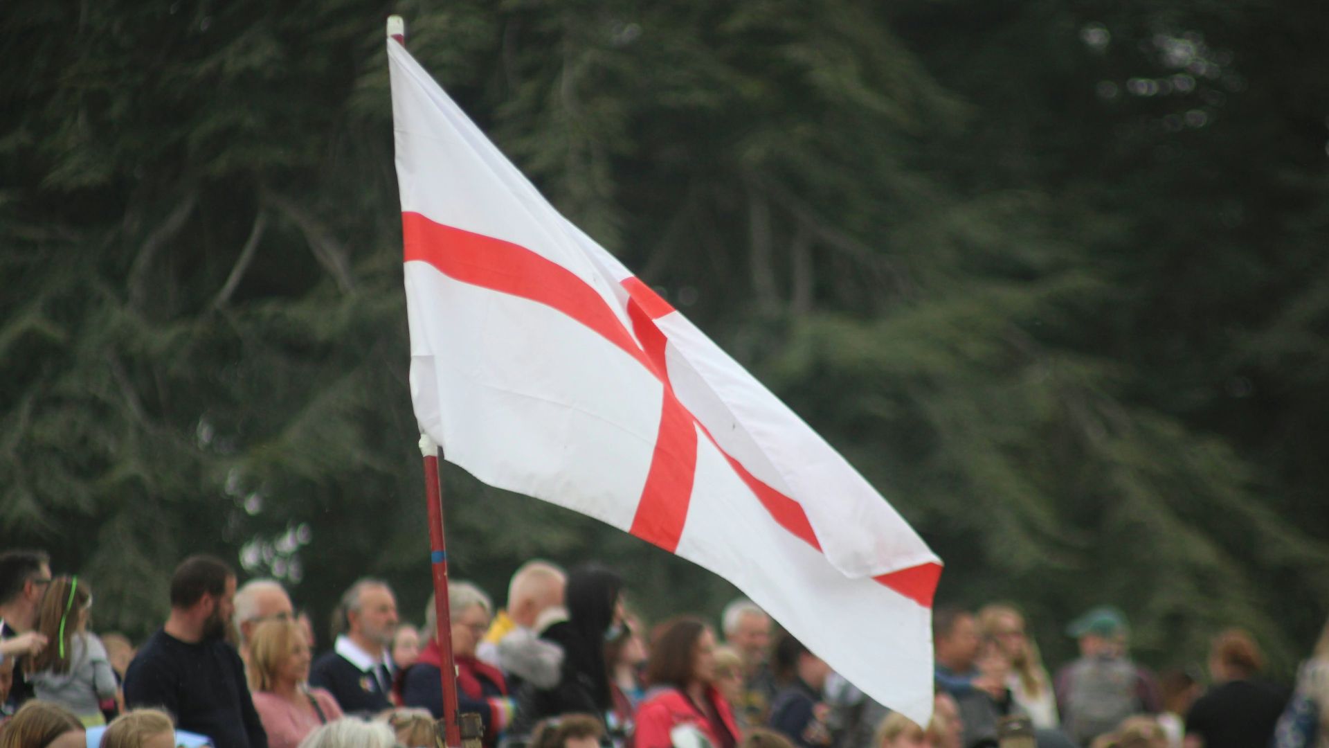 a group of people holding a flag
