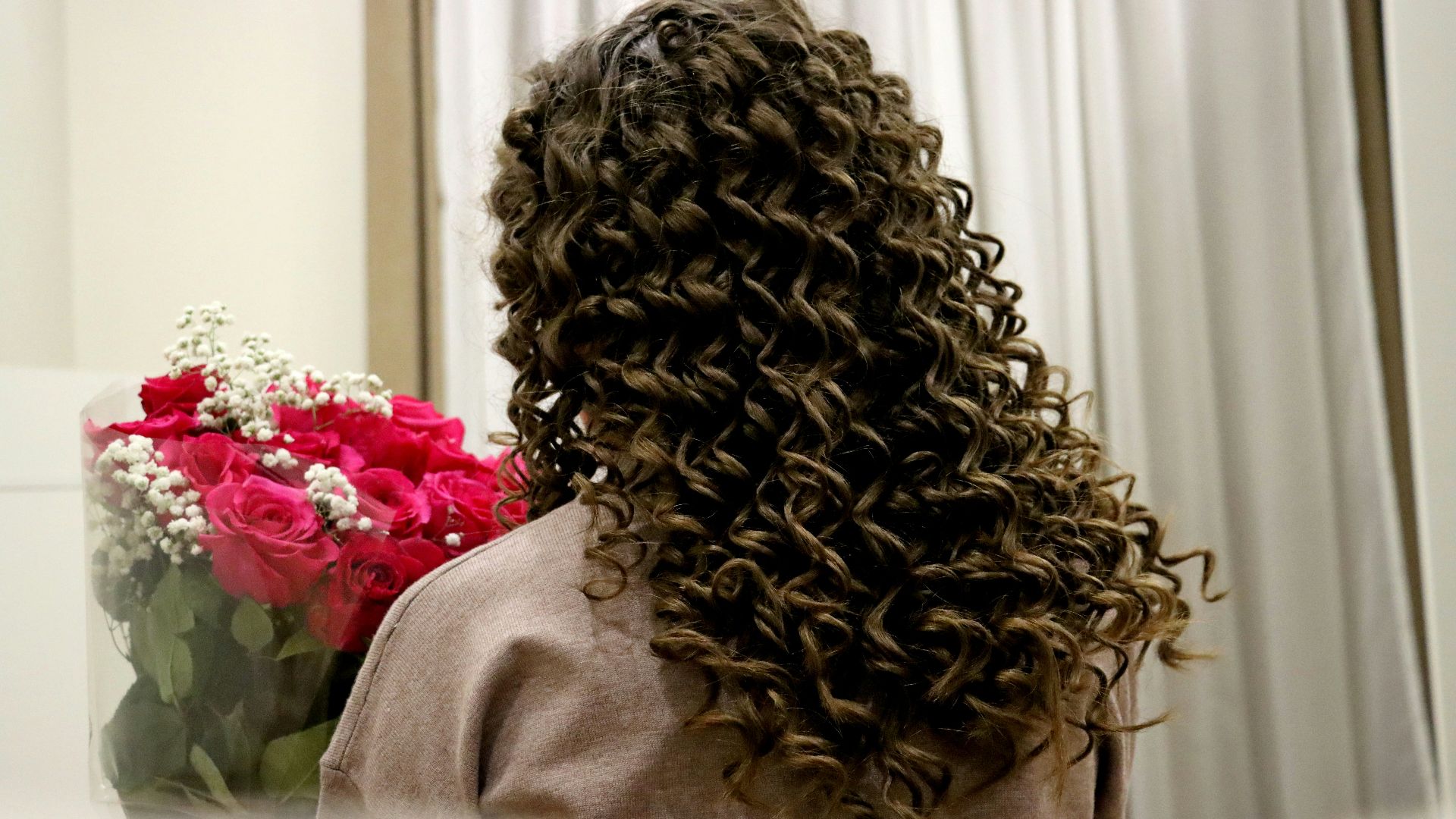 a dog with flowers on its head