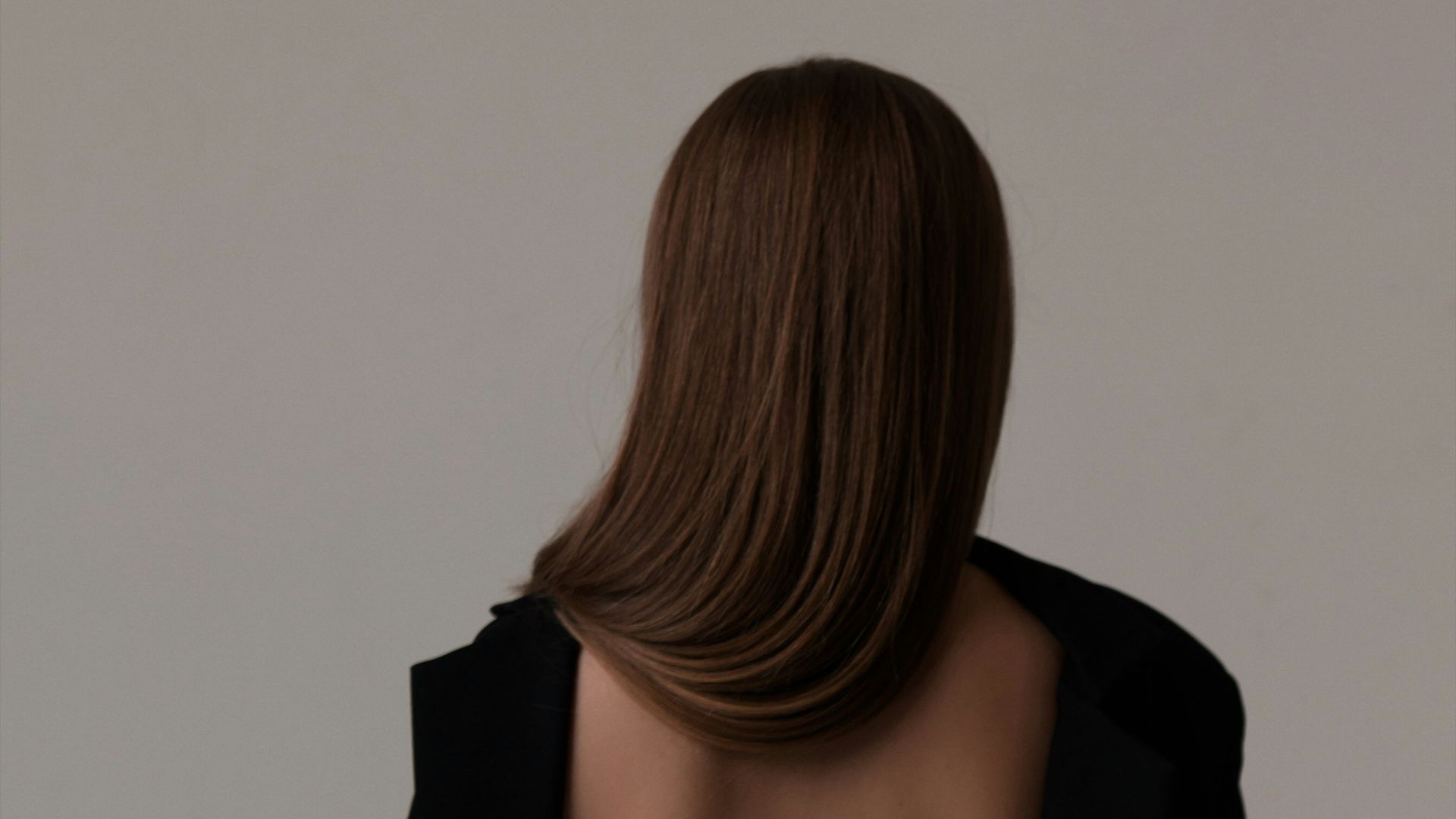 the back of a woman's head and shoulders