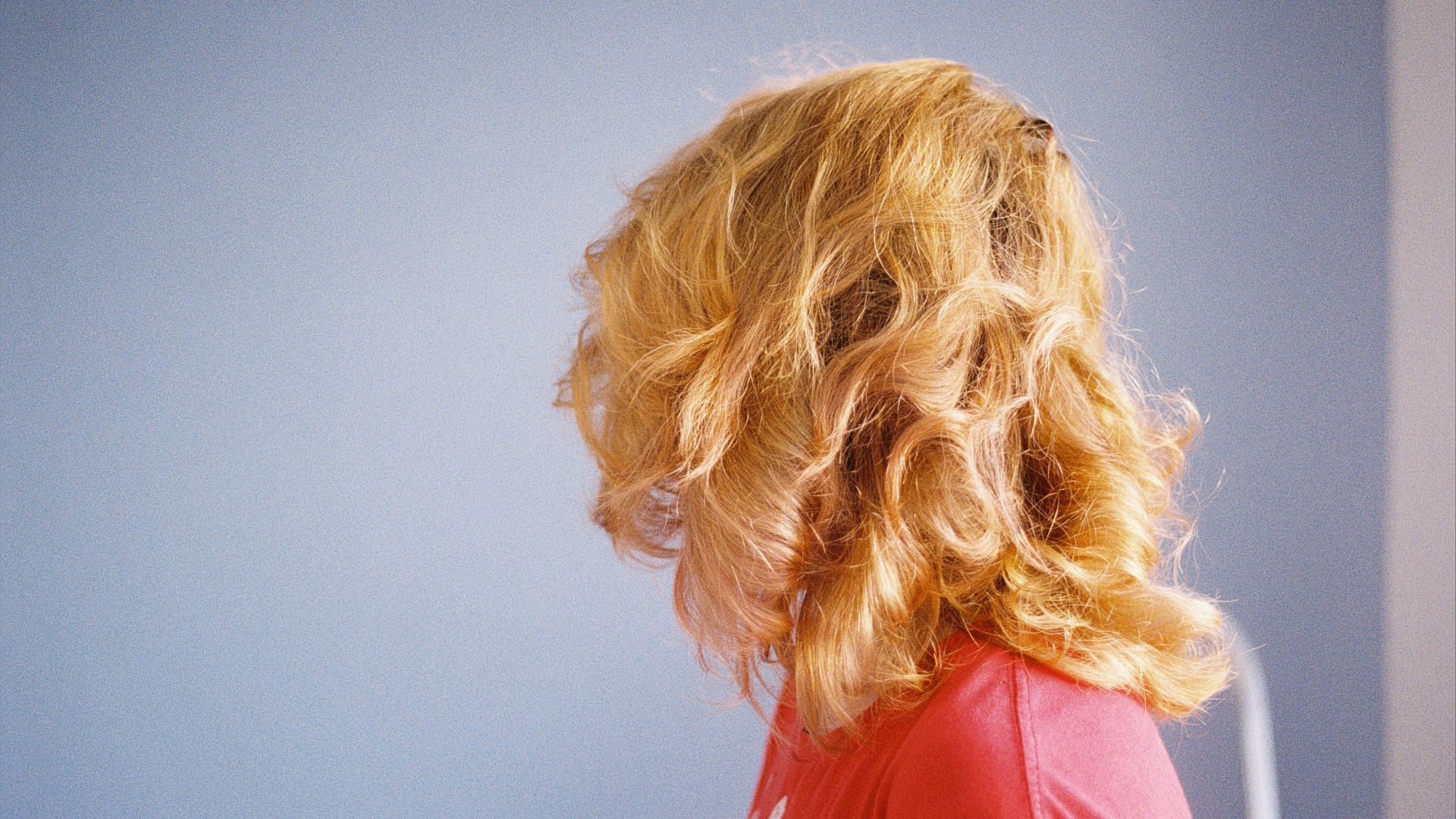 blonde haired woman in red shirt