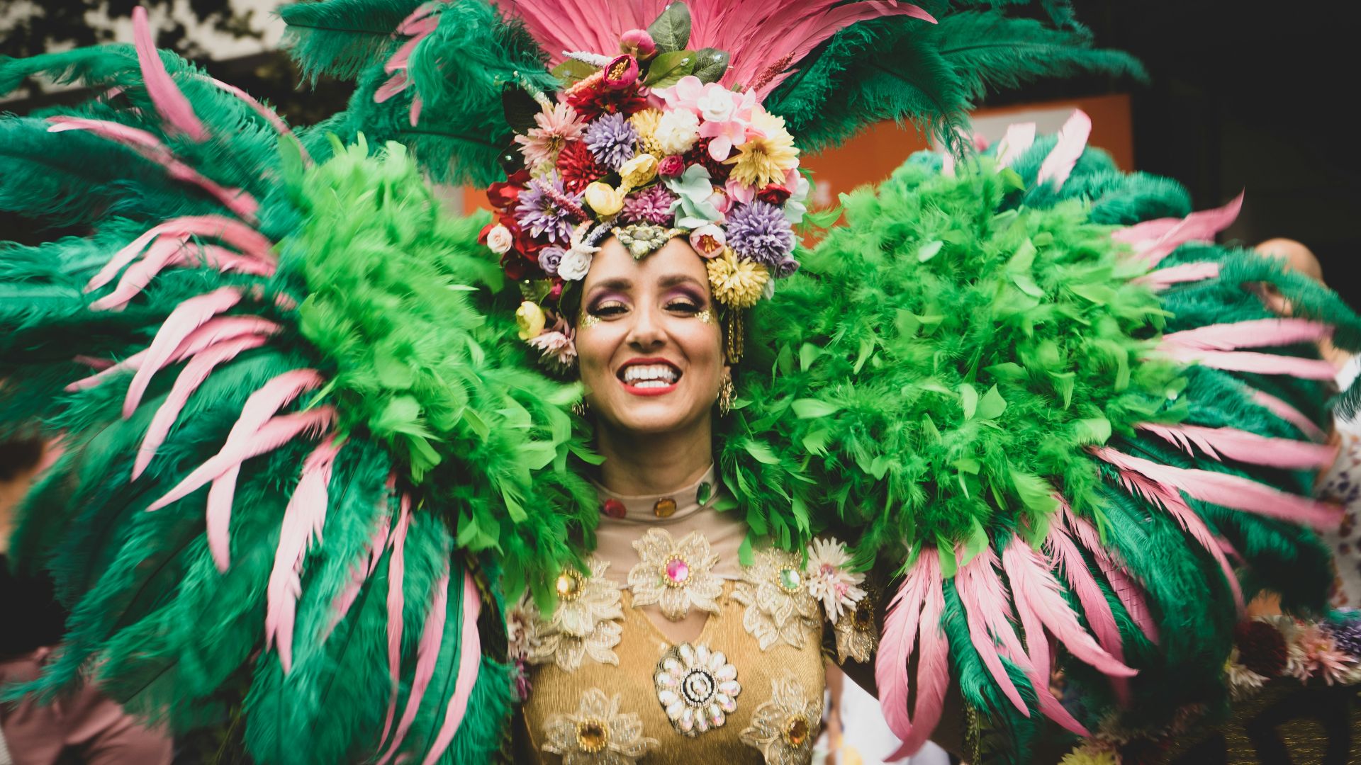 a woman in a green and pink costume