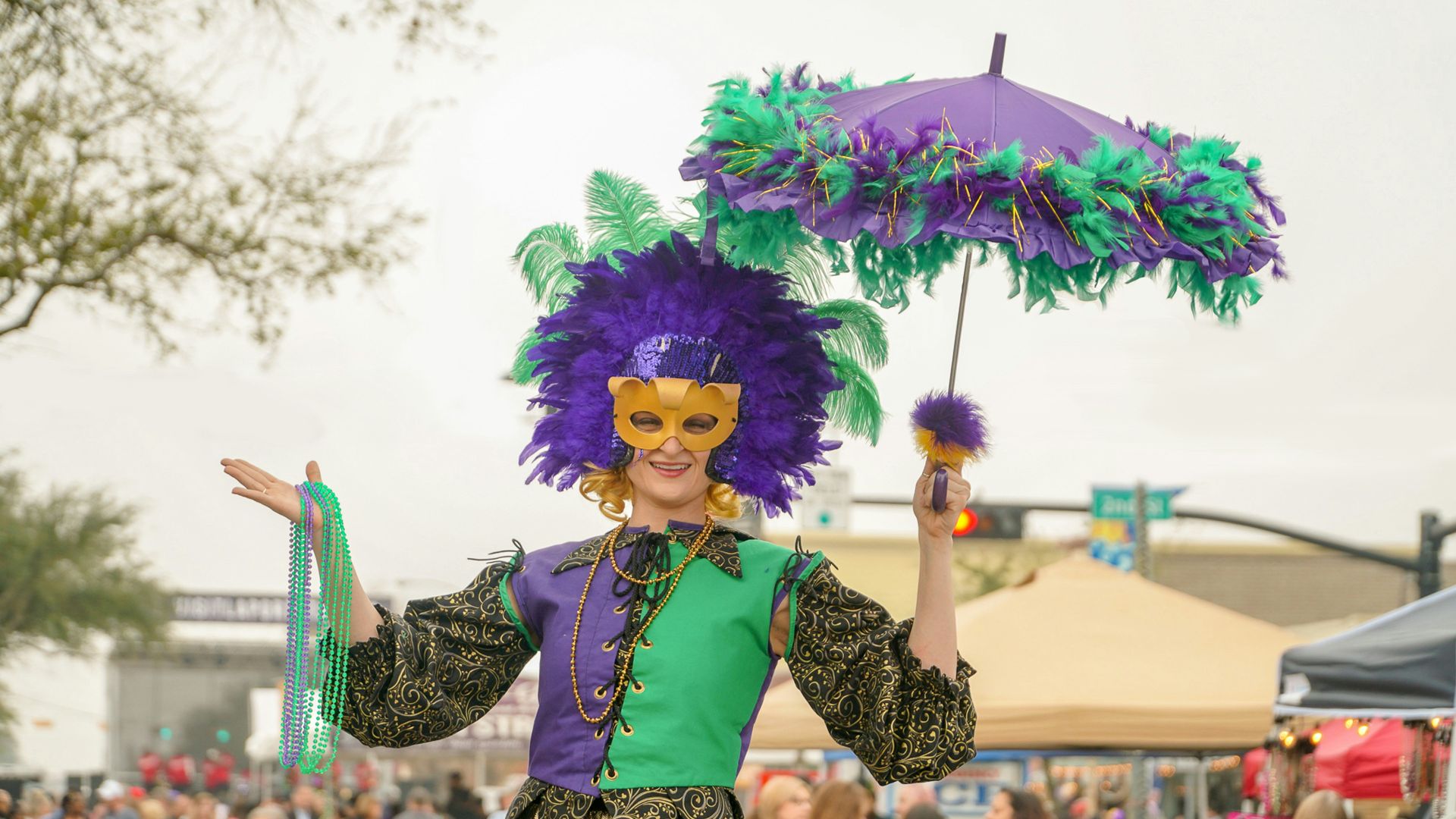 woman in purple and white dress holding umbrella