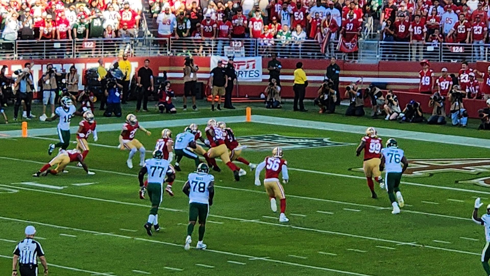 A football game is being played in a stadium