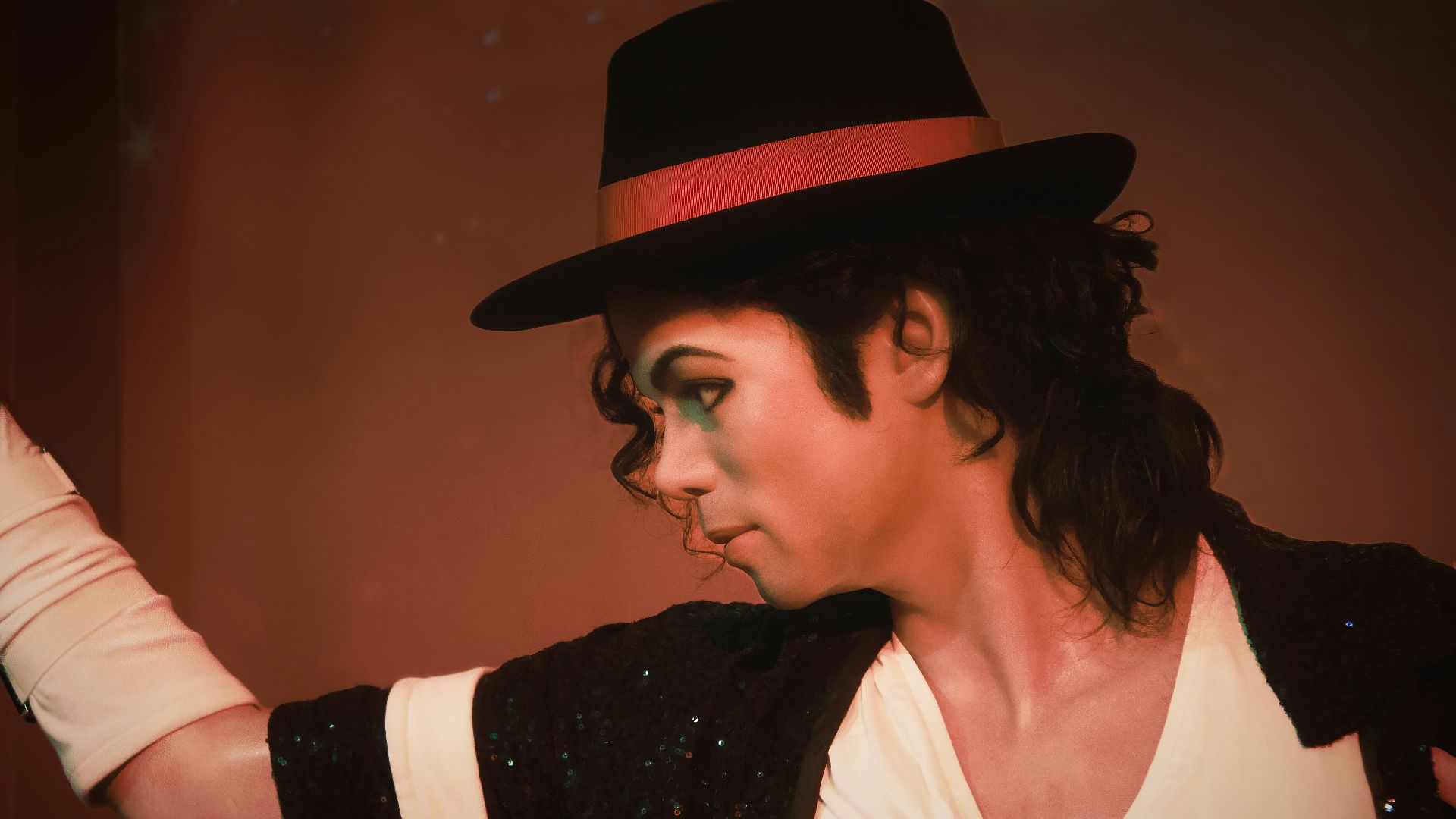 a man in a top hat and black jacket