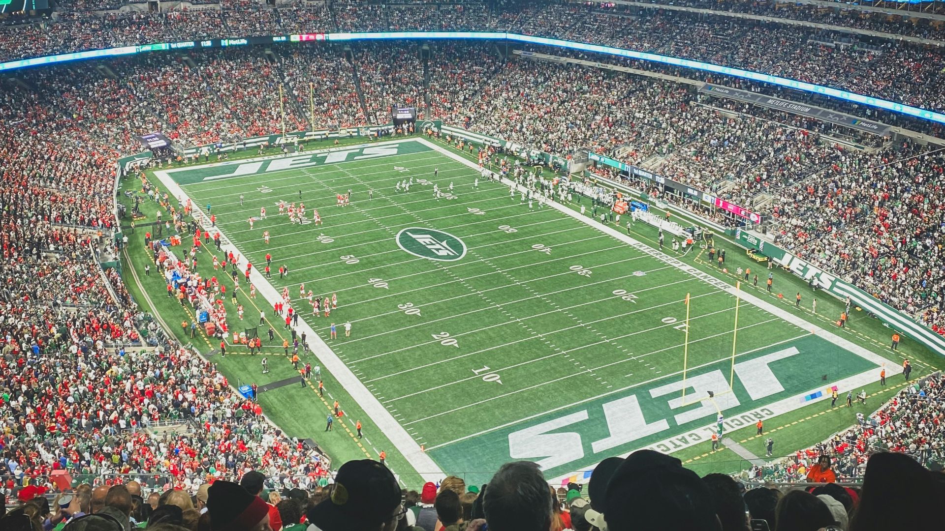 a stadium full of people watching a football game