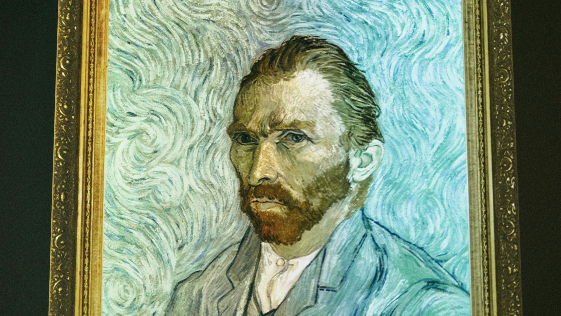 man and woman in black suit painting