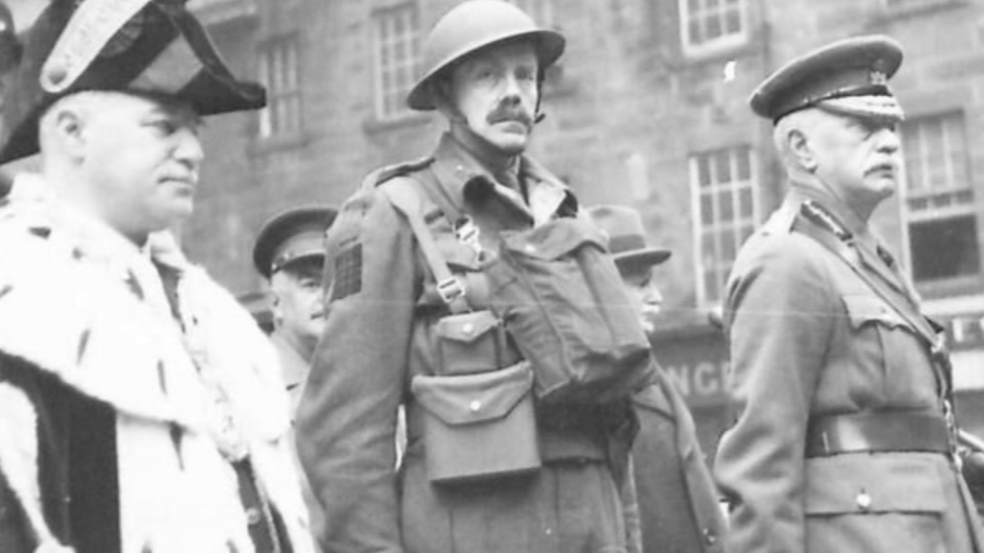 File:British Army officers and dignitaries salute marching Scottish troops in Inverness, 17 February 1941 IWM H 7363.jpg