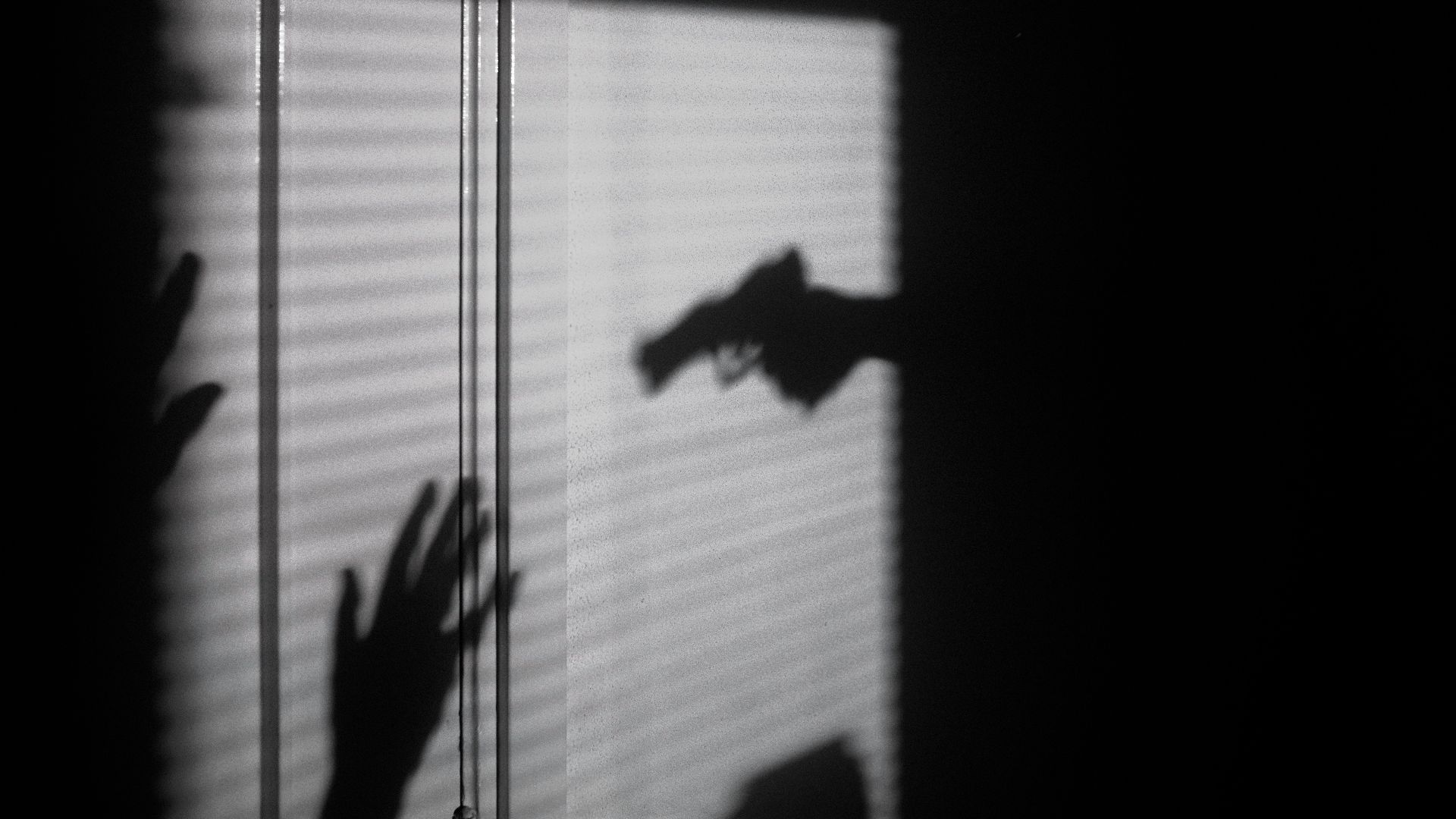 silhouette of person on window