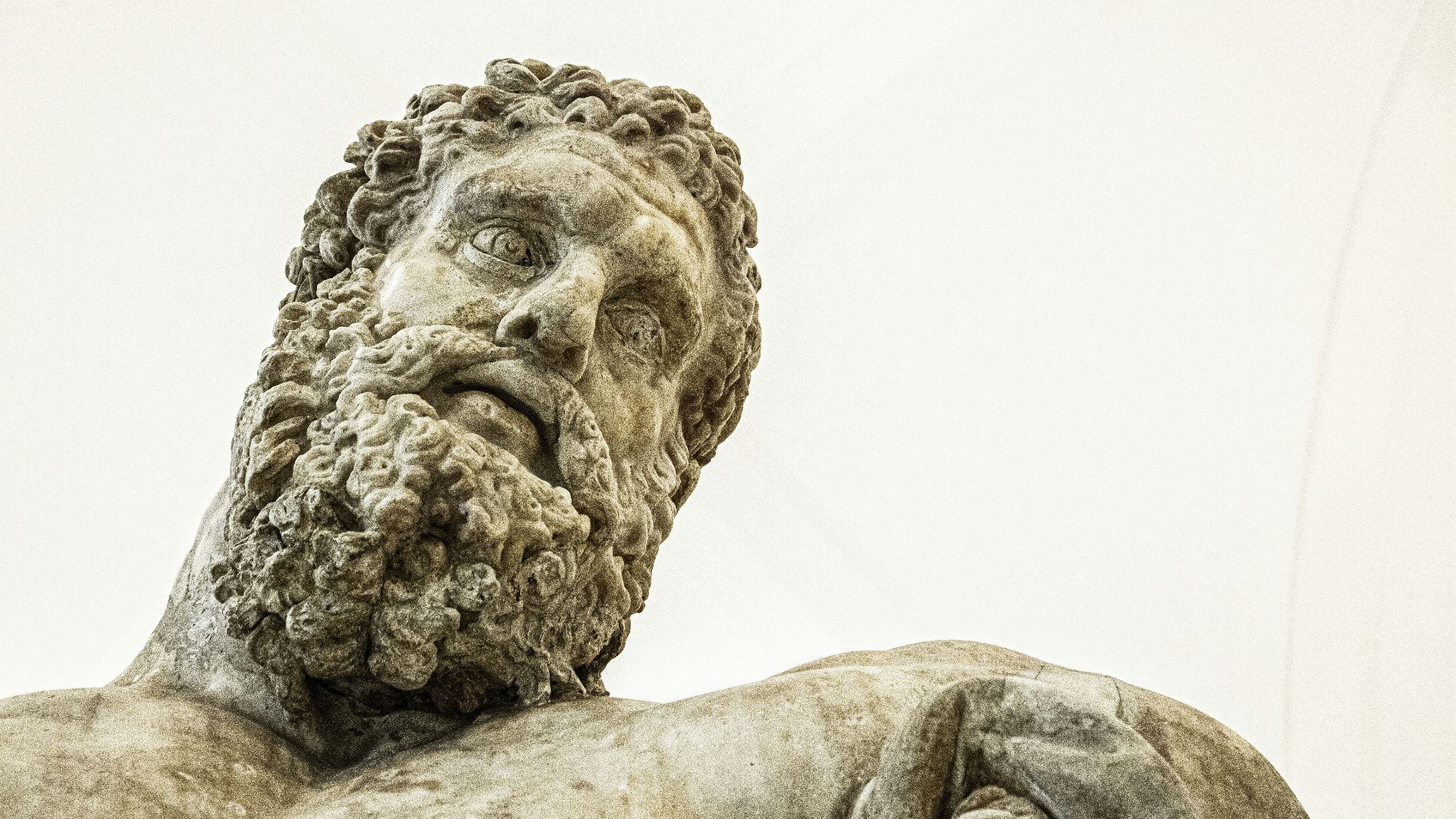 a close up of a statue of a man with a beard