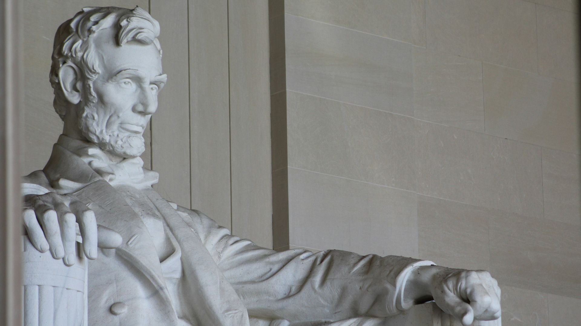 white concrete statue of man