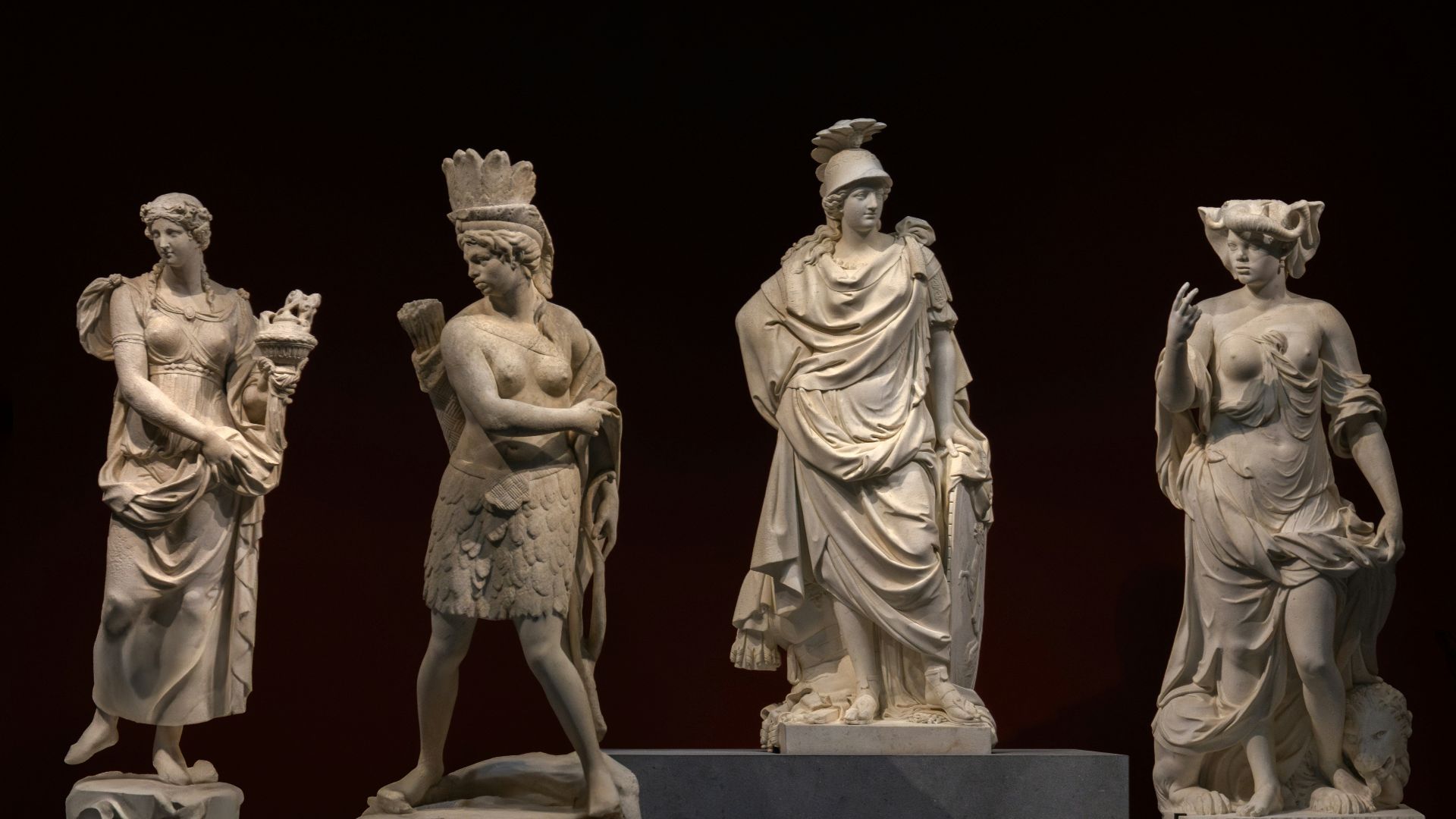 A group of statues sitting on top of a table