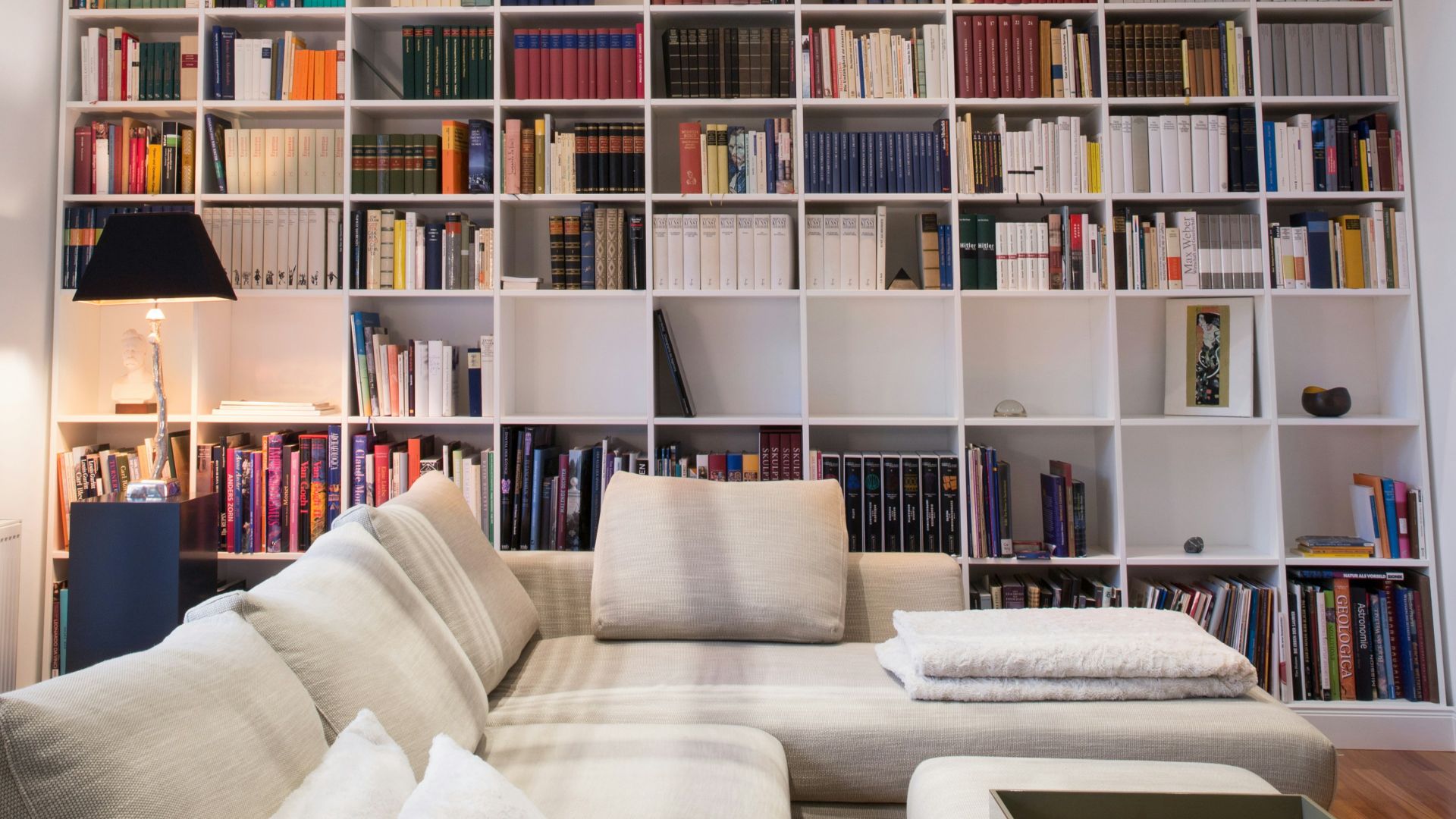 white wooden book shelves with books