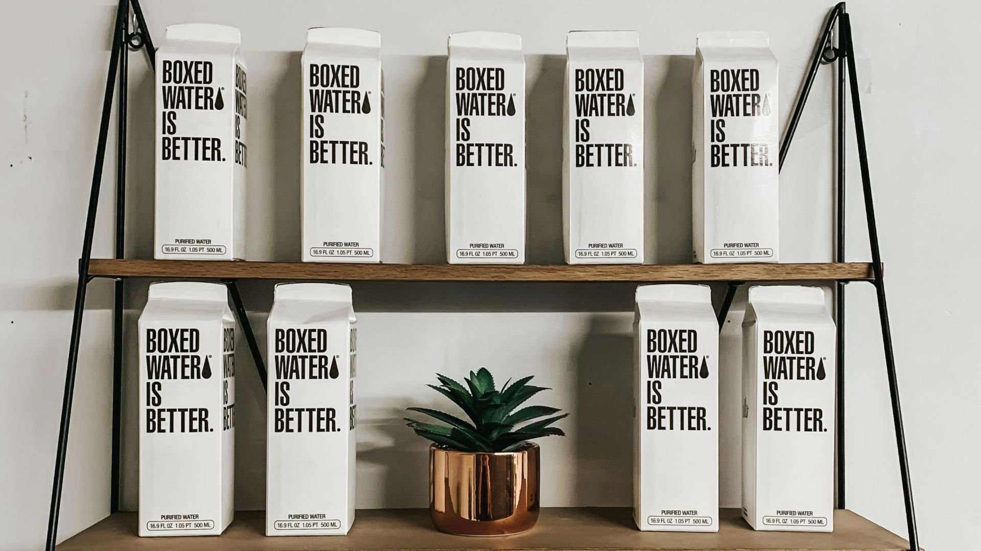 white and black labeled boxes on brown wooden rack